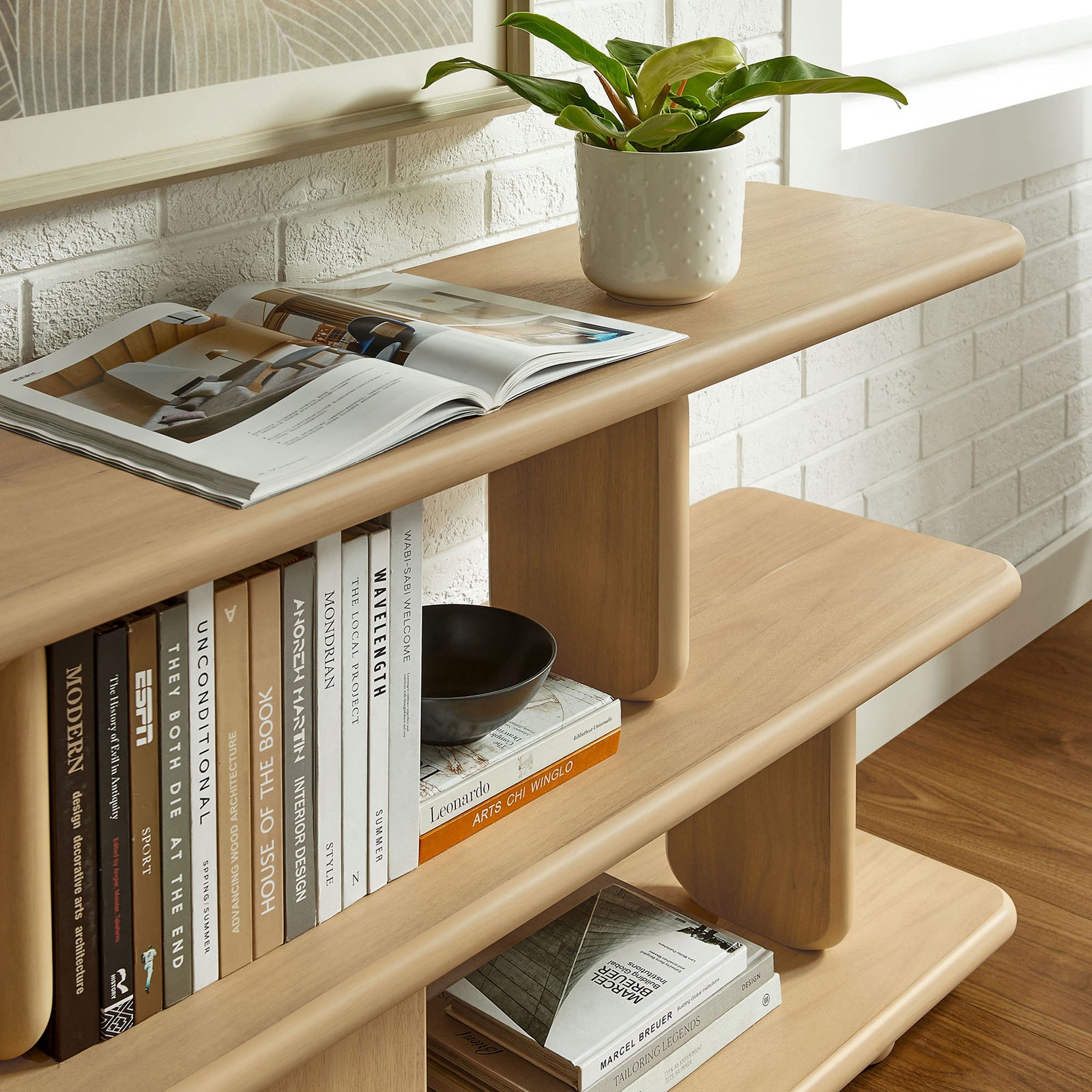 Rounded edges and sturdy supports frame books and accents with effortless modern appeal || EEI-7232-NAT || detail_room