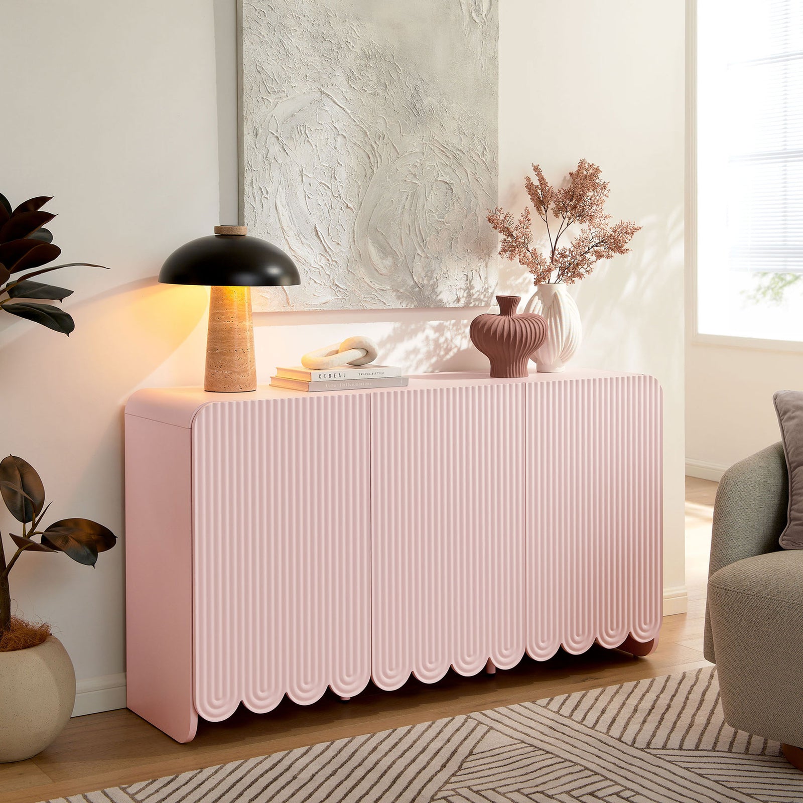 Soft pink Dahlia sideboard styled in a modern living room as a charming display and storage piece || EEI-7241-PNK || front_angle_room