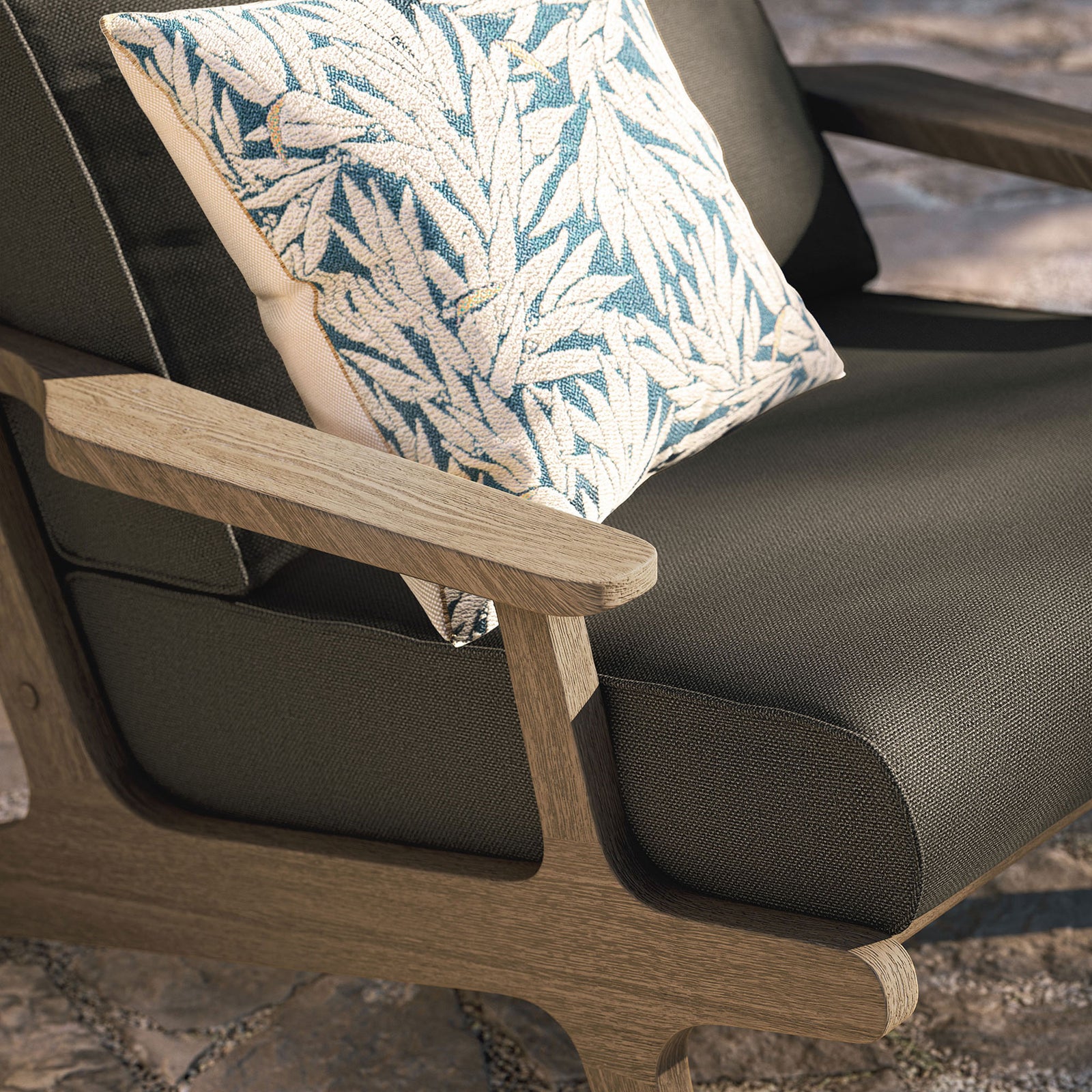 Saratoga flint gray chair armrest and cushion styled with a patterned outdoor throw pillow || EEI-7248-WGR-FLI || detail_room