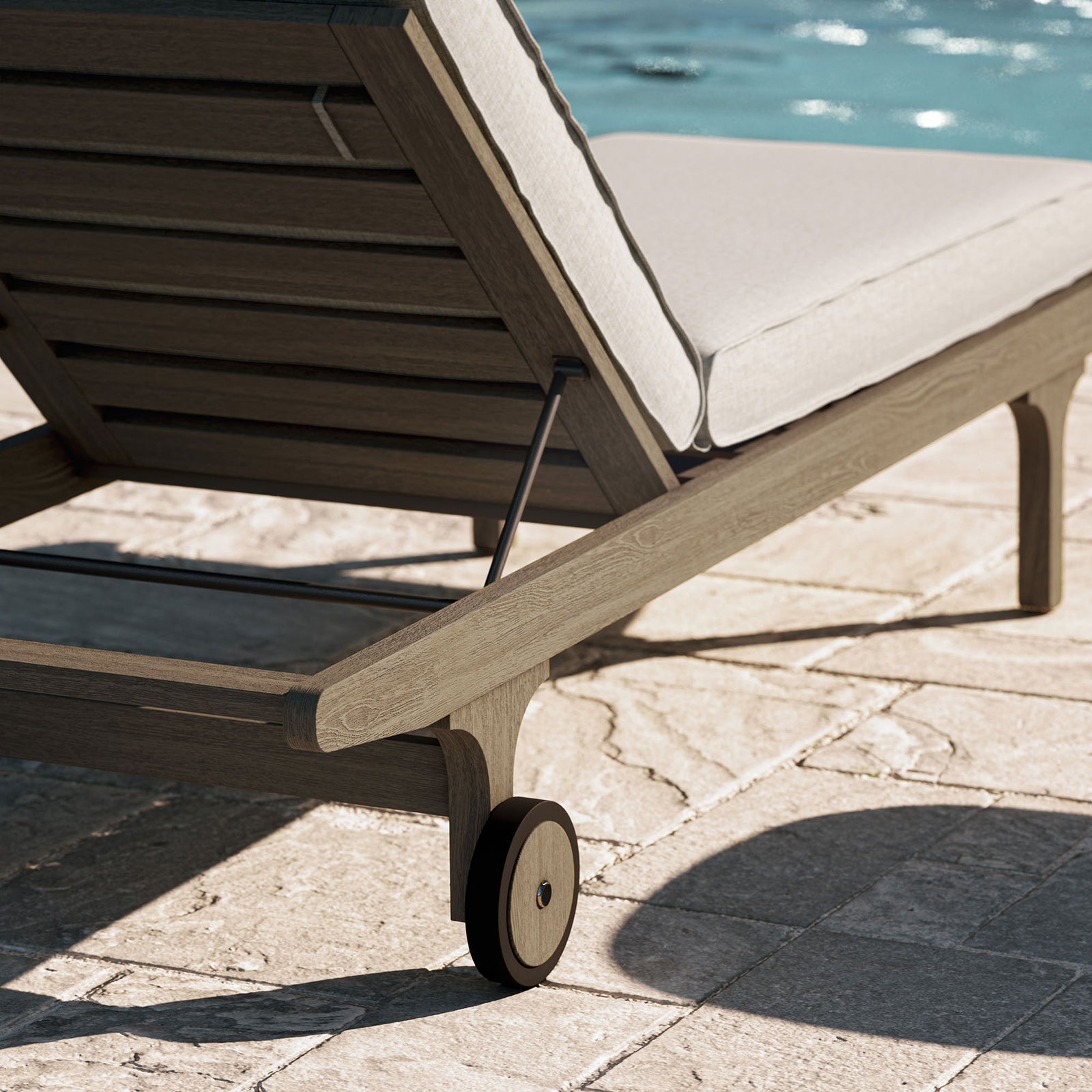 Teak chaise corner and wheel beside a sparkling pool with soft pebble cushions || EEI-7251-WGR-PEB || leg_room