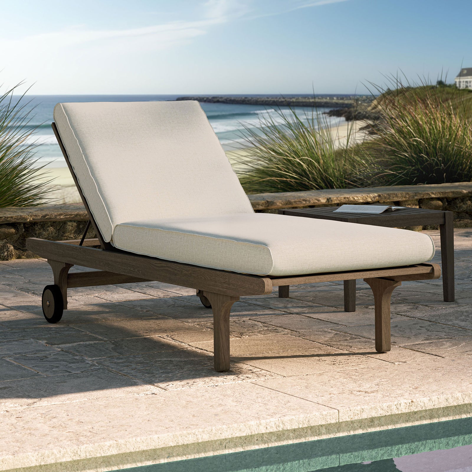 Pebble cushioned teak chaise lounge styled by a sunlit pool for inviting outdoor relaxation || EEI-7251-WGR-PEB || front_angle_room