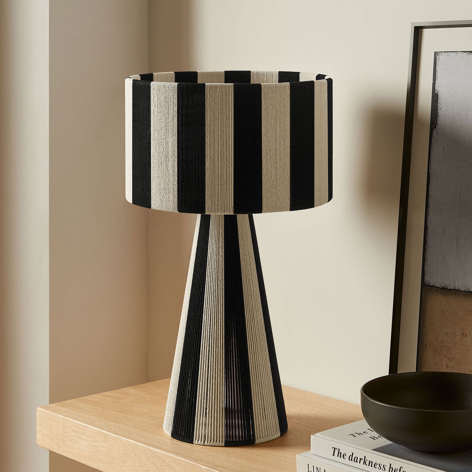 Renae striped table lamp in black and cream styles a clean console tabletop vignette. || EEI-7261-BLK || front_room