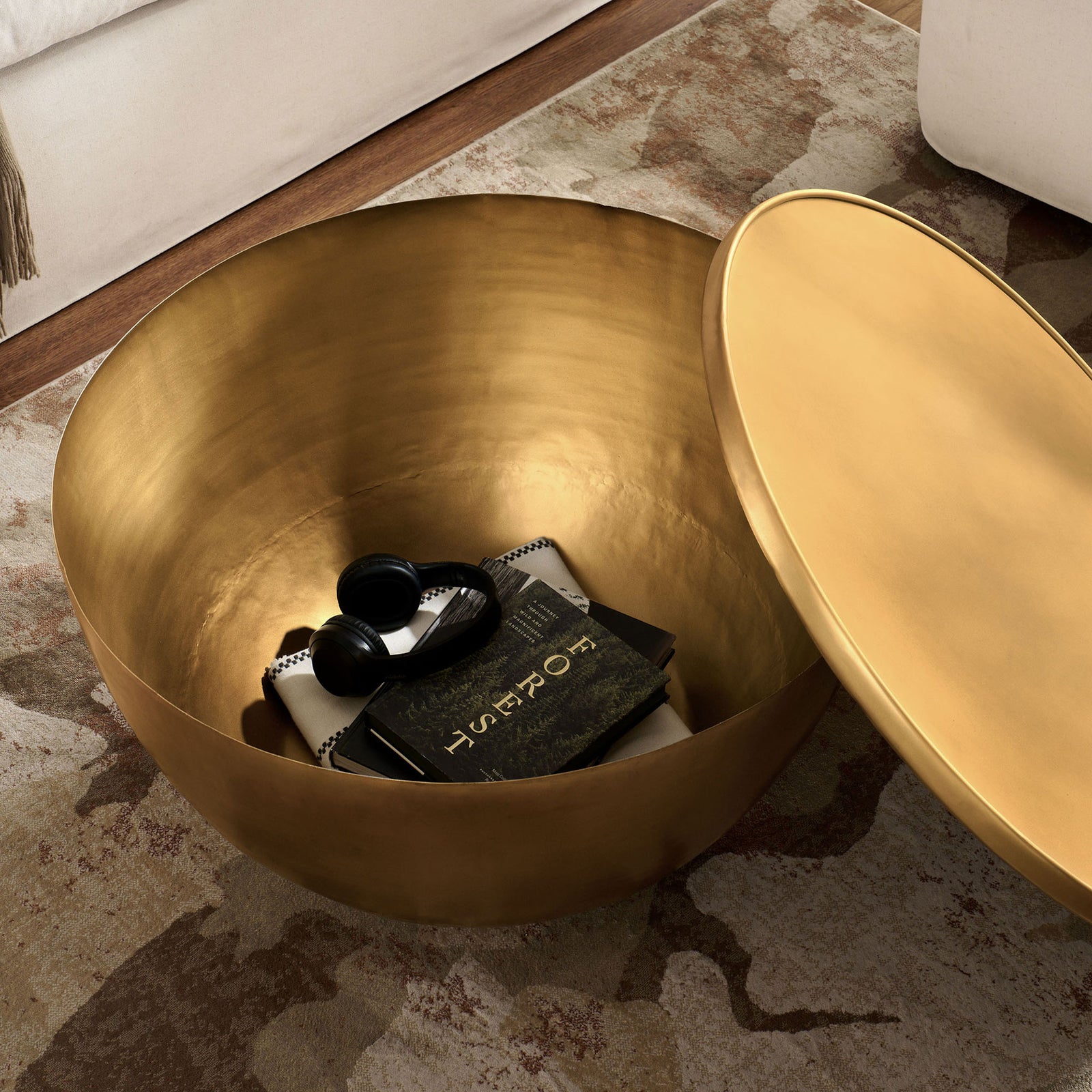 Hidden compartment keeps remotes and throws out of sight while maintaining a chic, sculptural look || EEI-7277-BBR || top_angle_open_room