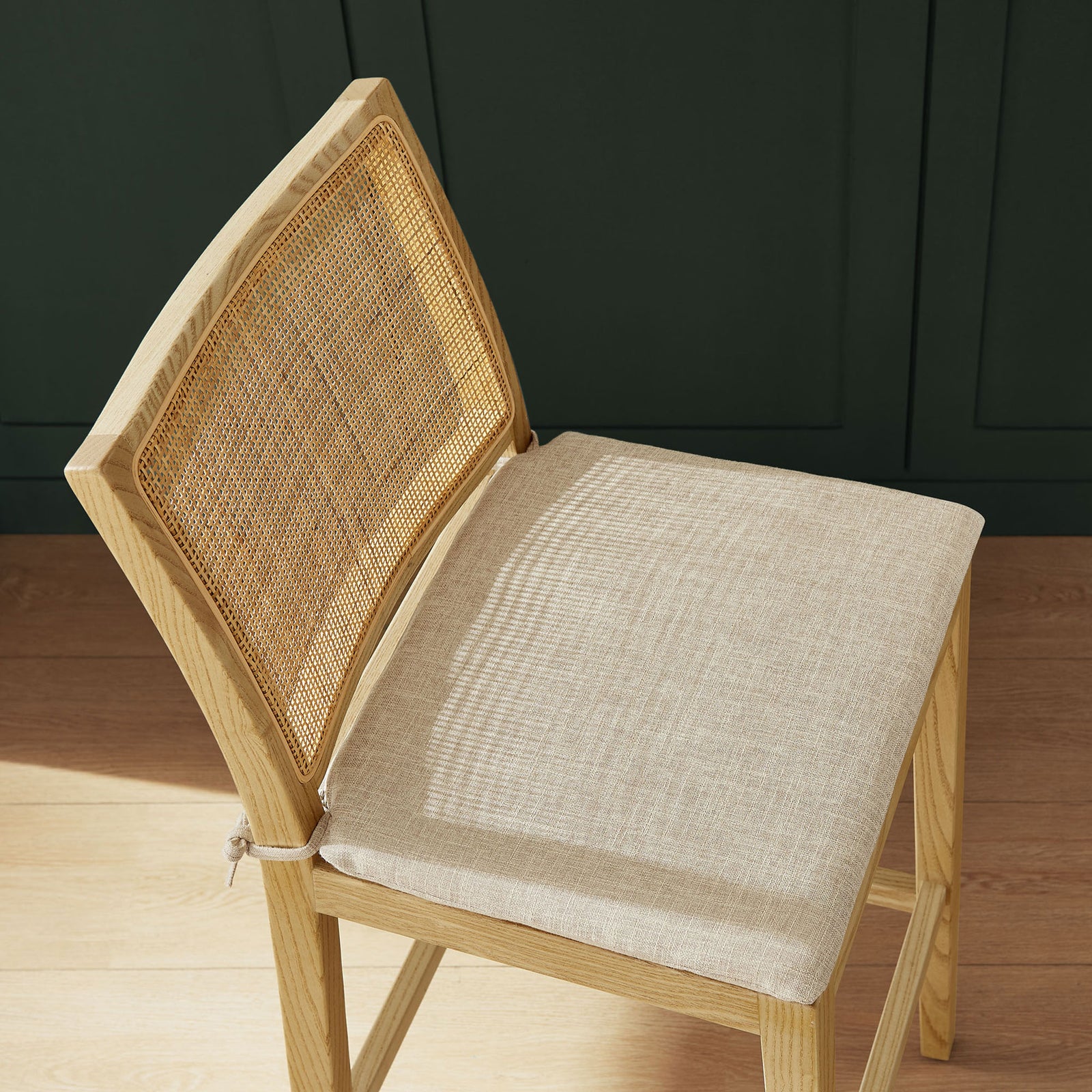 Beige fabric cushion and woven cane back offer soft comfort with coastal flair. || EEI-7289-NAT-BEI || detail_room