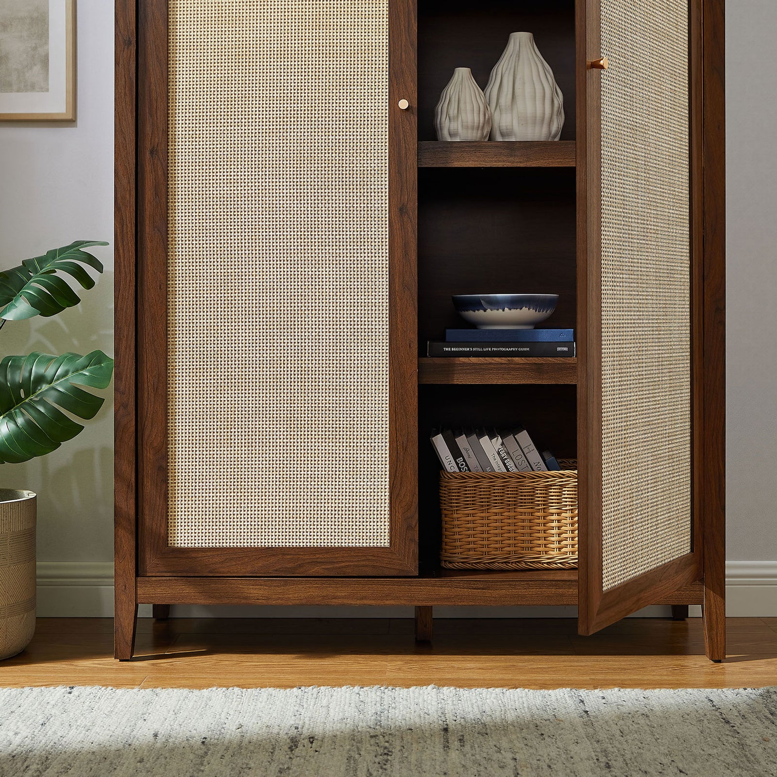 Styled walnut cabinet with open door showcasing decor pieces and basket on interior shelving || EEI-7294-WAL || storage_open_room