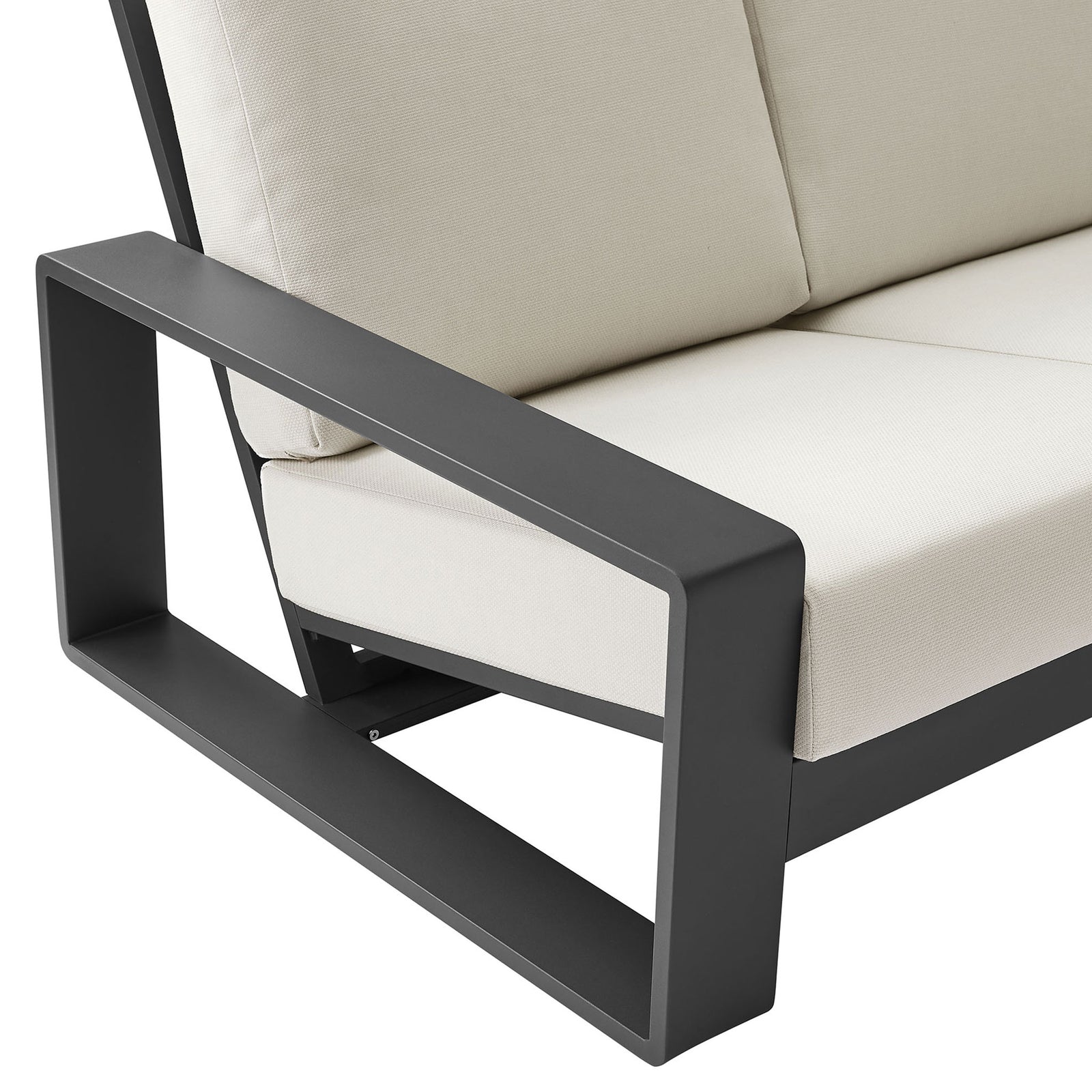 Charcoal aluminum arm and thick cream cushion showcasing the sofa's crisp modern lines || EEI-7302-CRE-GRY || detail_studio