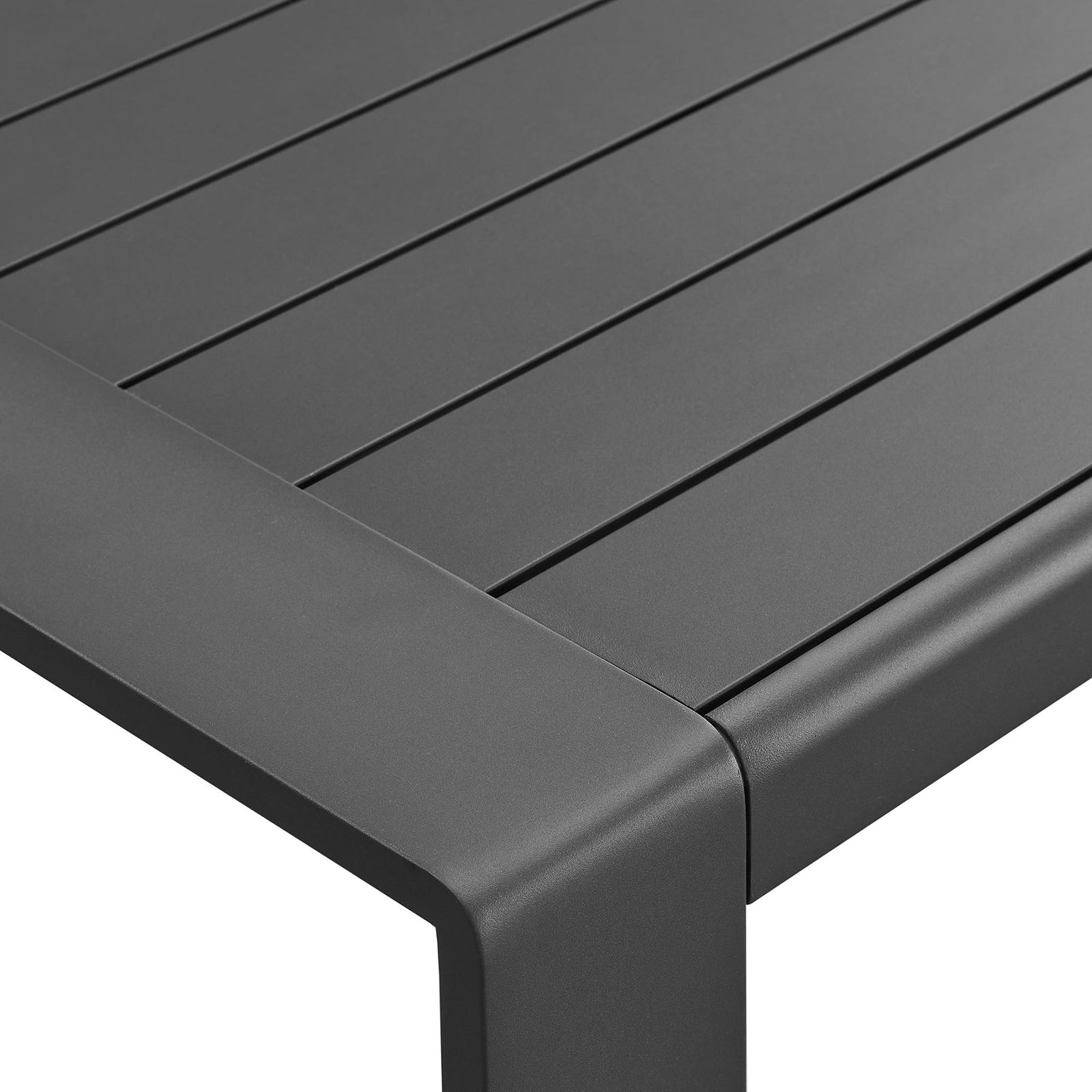 Smoothly rounded corner of gray aluminum coffee table with crisp slatted surface || EEI-7303-GRY || detail_studio