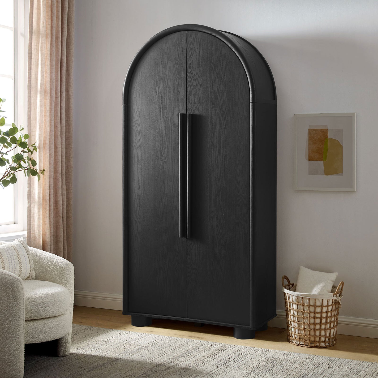 Bellamy black tall arched storage cabinet styled in a modern living room with soft light || EEI-7313-BLK || front_angle_room