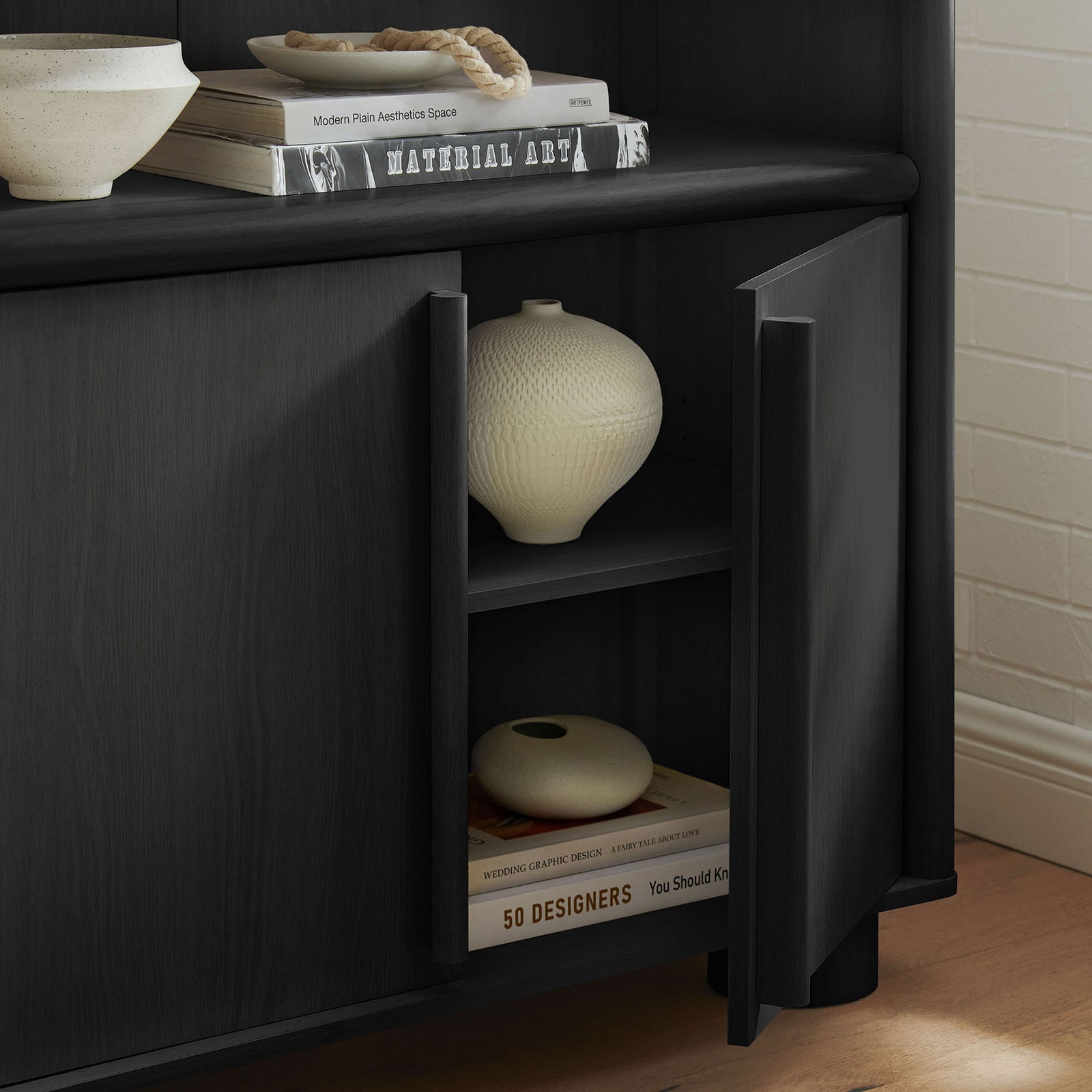 Interior storage keeps clutter out of sight with hinged doors and an adjustable shelf || EEI-7314-BLK || storage_open_room
