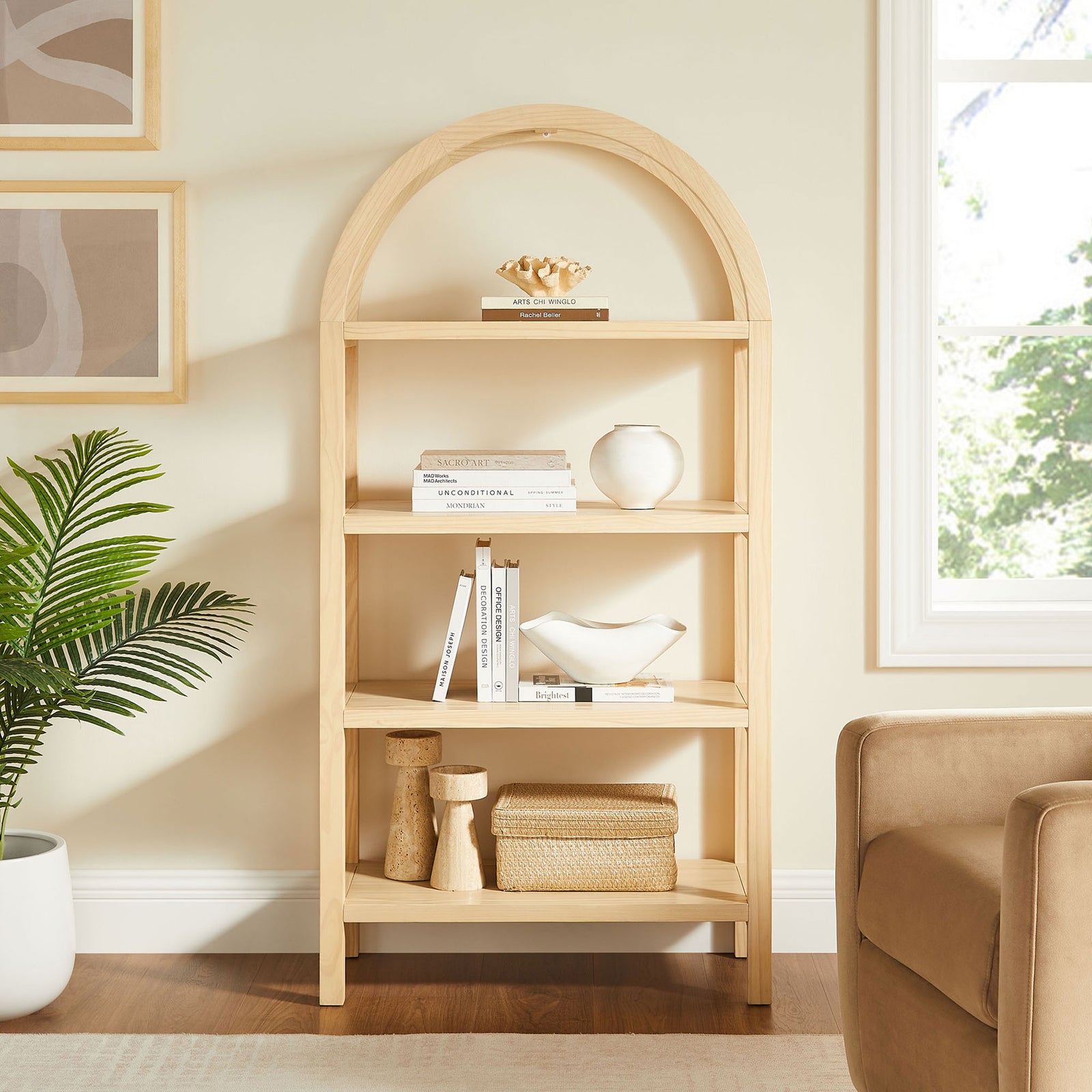 Modern arched bookshelf brings sculptural warmth to living rooms with four shelves in a natural finish || EEI-7317-NAT || front_room