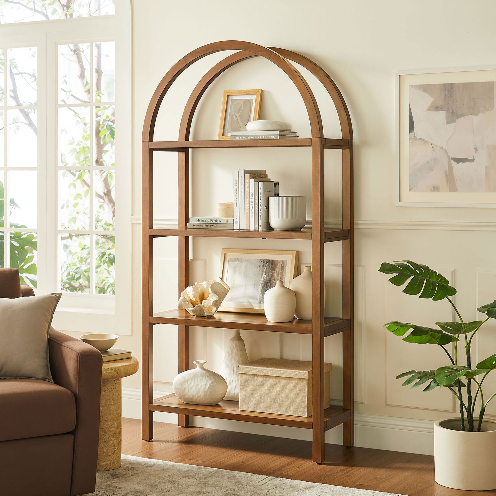 Large arched bookshelf anchors the room with sculptural form and ample storage || EEI-7318-WAL || front_angle_room