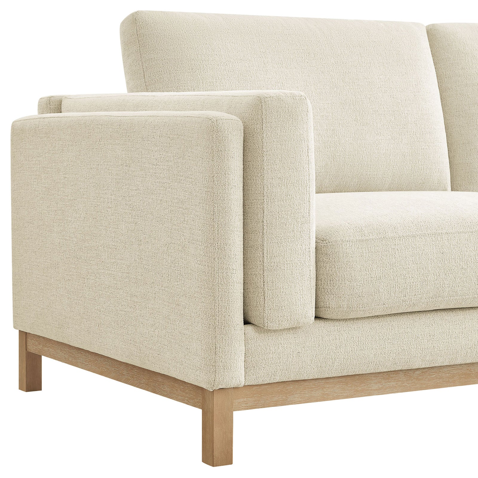 Padded arm and seat corner highlighting the soft textured ivory chenille upholstery and wood base || EEI-7327-IVO || detail_studio