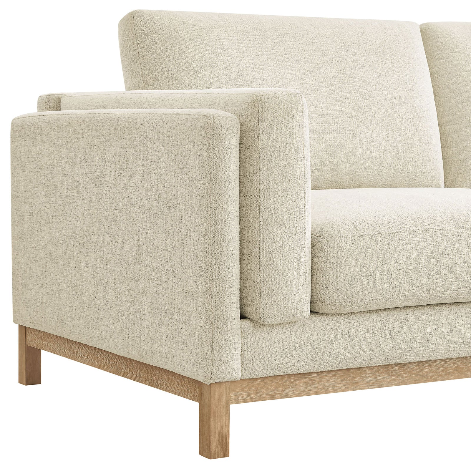Detail of the wrapped armrest, plush seat cushioning, and natural wood base. || EEI-7328-IVO || detail_studio