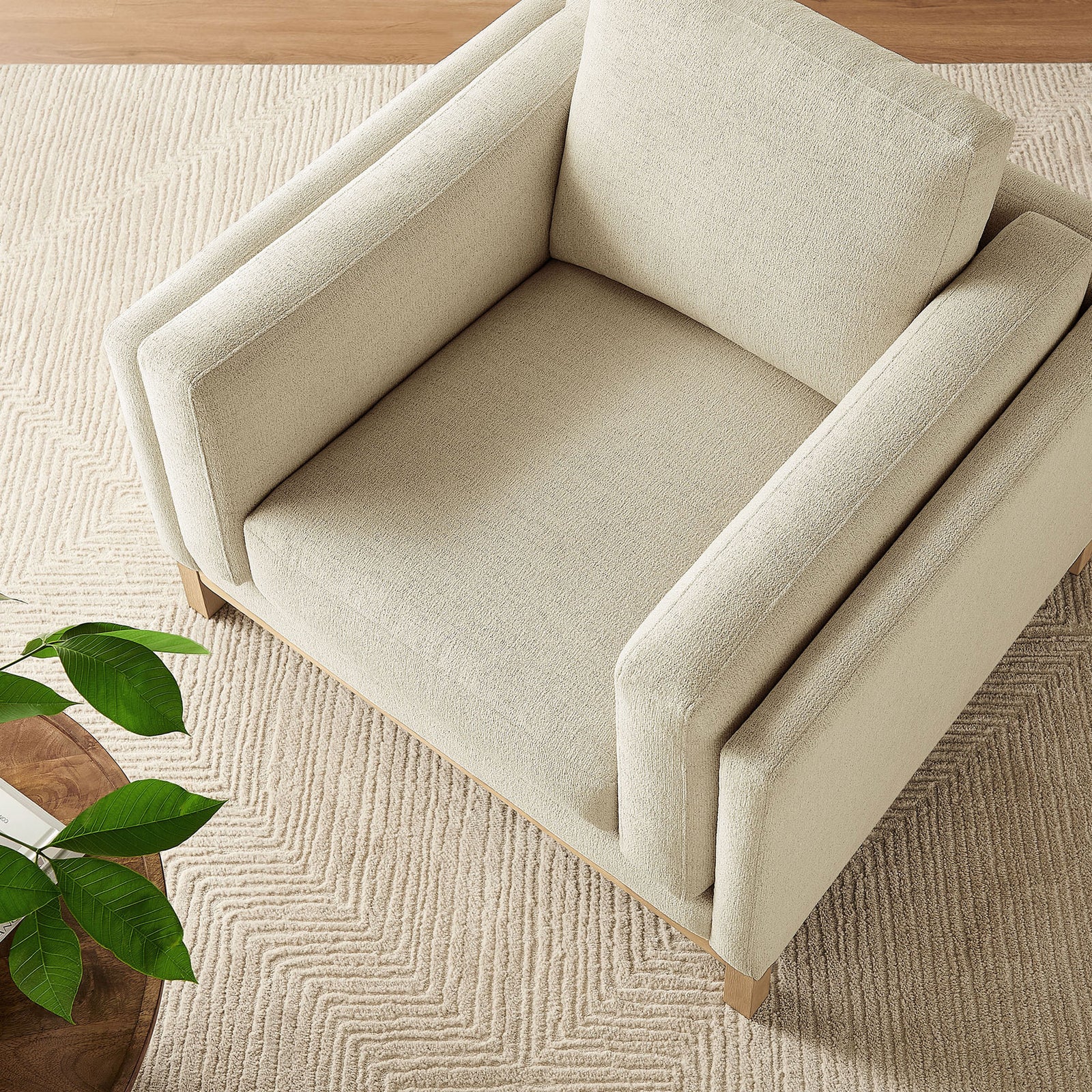 Deep-seated ivory armchair pairs plush chenille with a warm wood base for inviting comfort || EEI-7329-IVO || top_angle_room