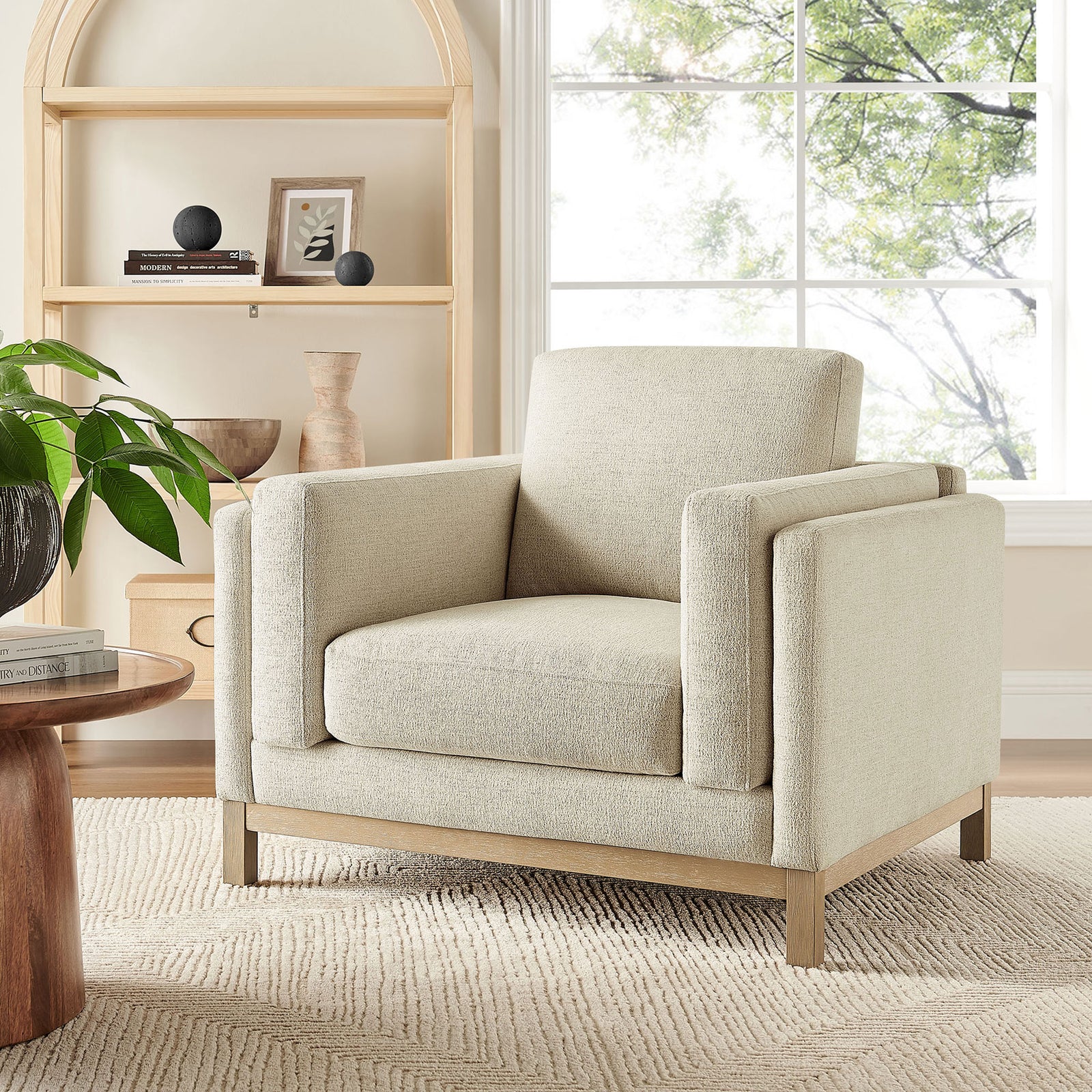 Ivory armchair anchors the living space with tailored lines and a weathered wood base || EEI-7329-IVO || front_angle_room