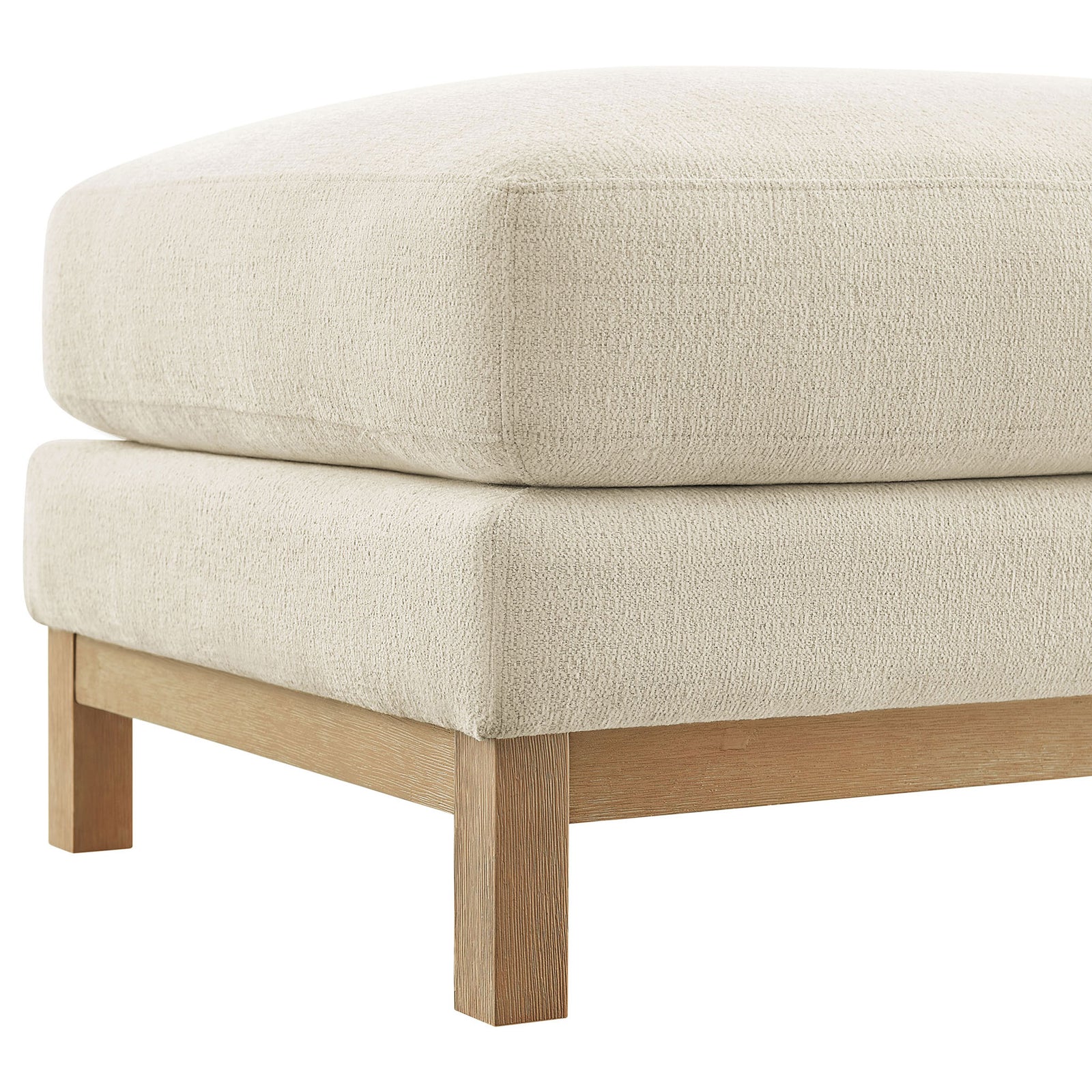 Close-up of ivory ottoman corner highlighting textured chenille and wood leg || EEI-7330-IVO || detail_studio