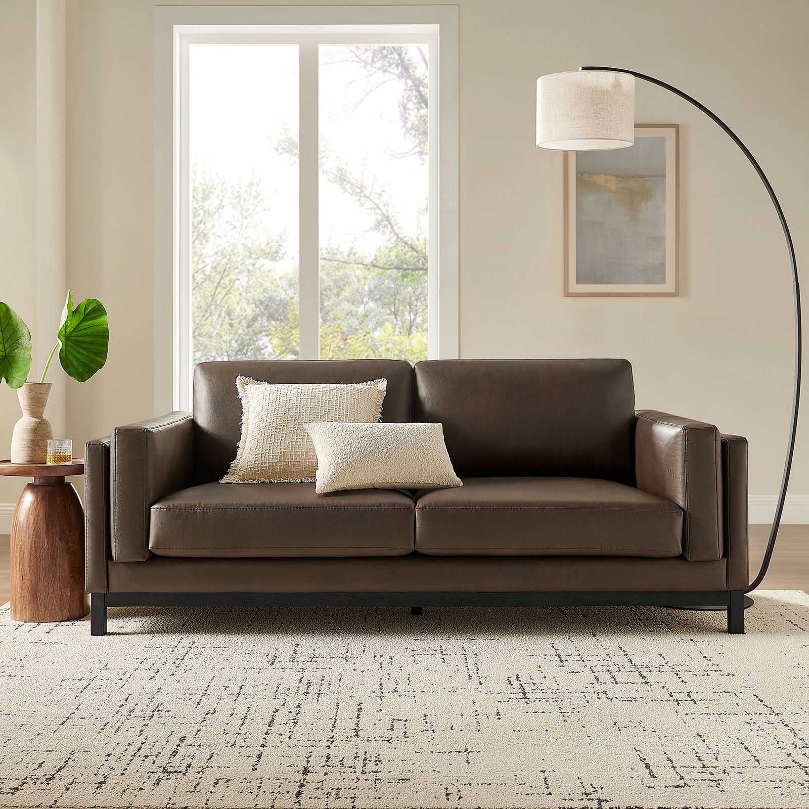 Roscoe espresso vegan leather sofa styled in a modern living room with pillows and accent pieces || EEI-7335-ESP || front_room