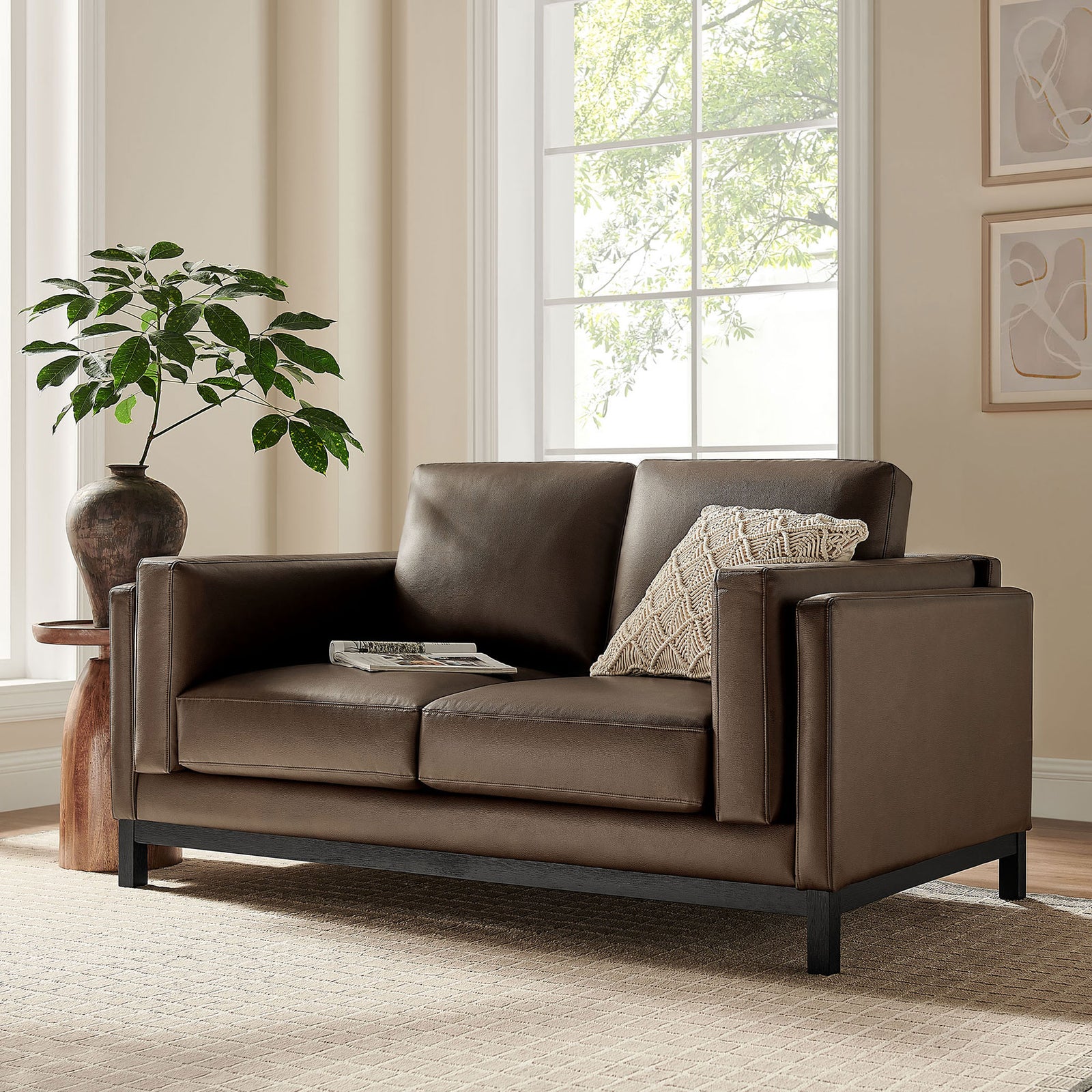 Espresso vegan leather loveseat styled in a modern living room with soft rug, artwork, and greenery || EEI-7336-ESP || front_angle_room