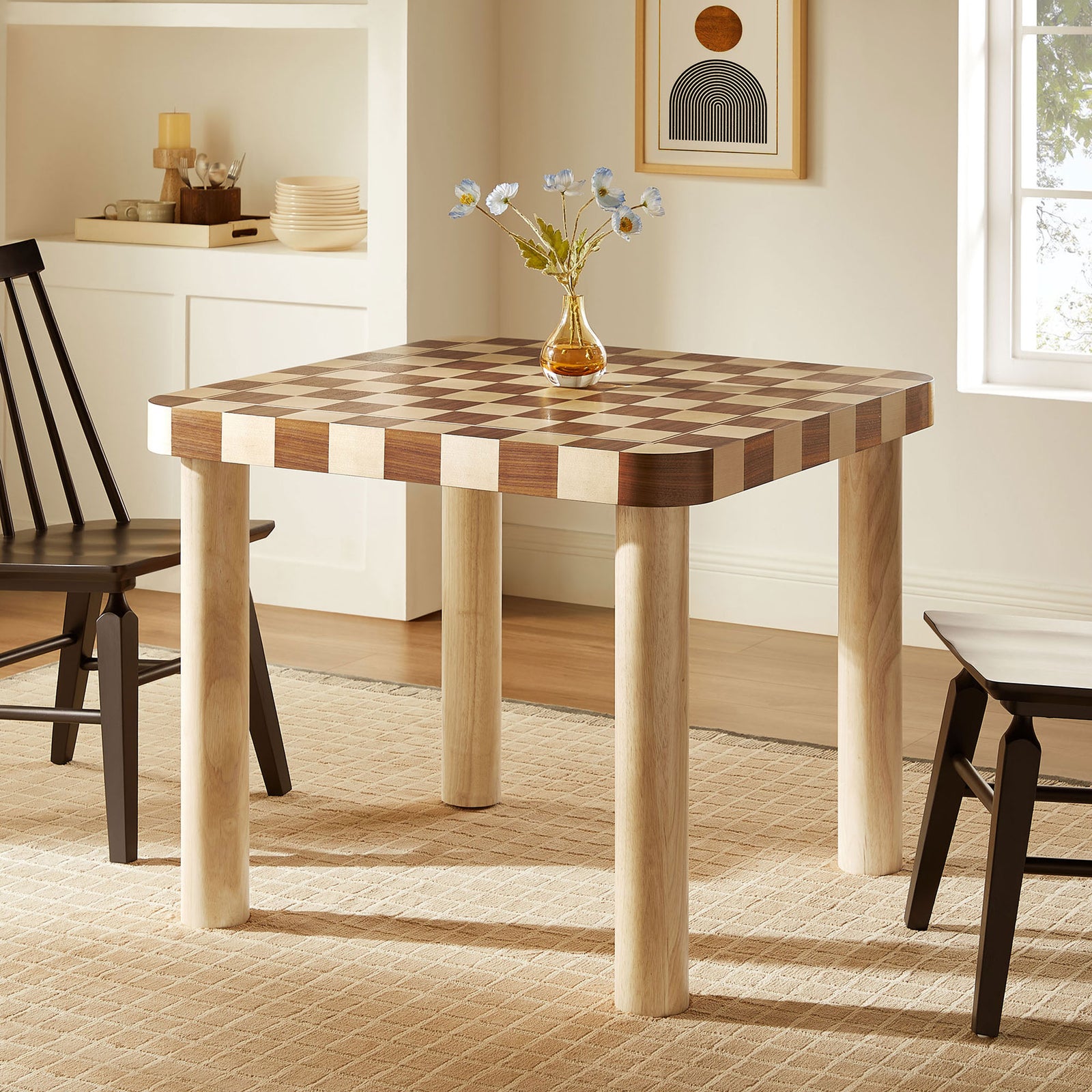 Oscar checkered dining table creates a cozy gathering spot in a light-filled dining nook. || EEI-7351-OWC || front_angle_room