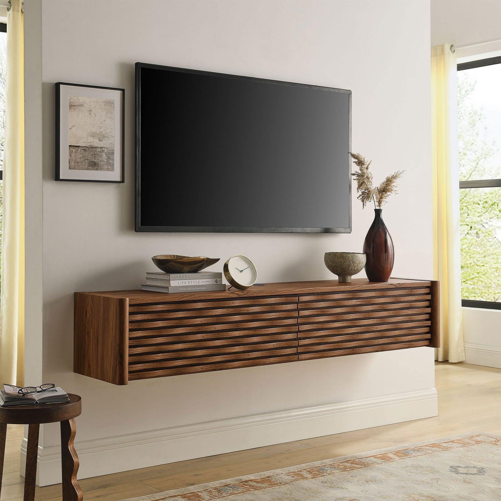 Walnut floating media console styled beneath a wall-mounted TV for a warm, contemporary living room focal point || EEI-7352-WAL || front_angle_room
