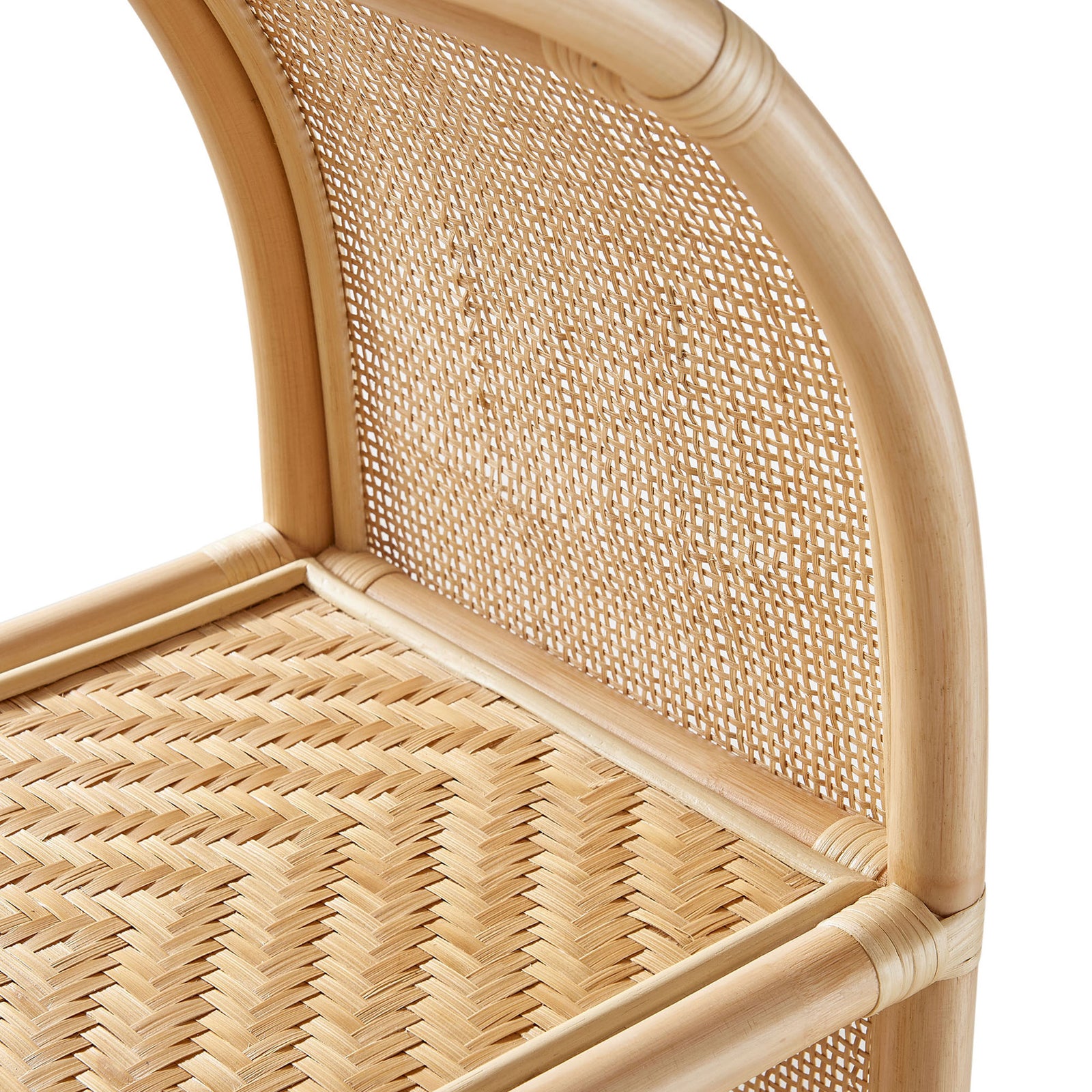 Curved arch and woven cane shelf highlight the bookcase's warm, handwoven rattan texture. || EEI-7363-NAT || detail_studio