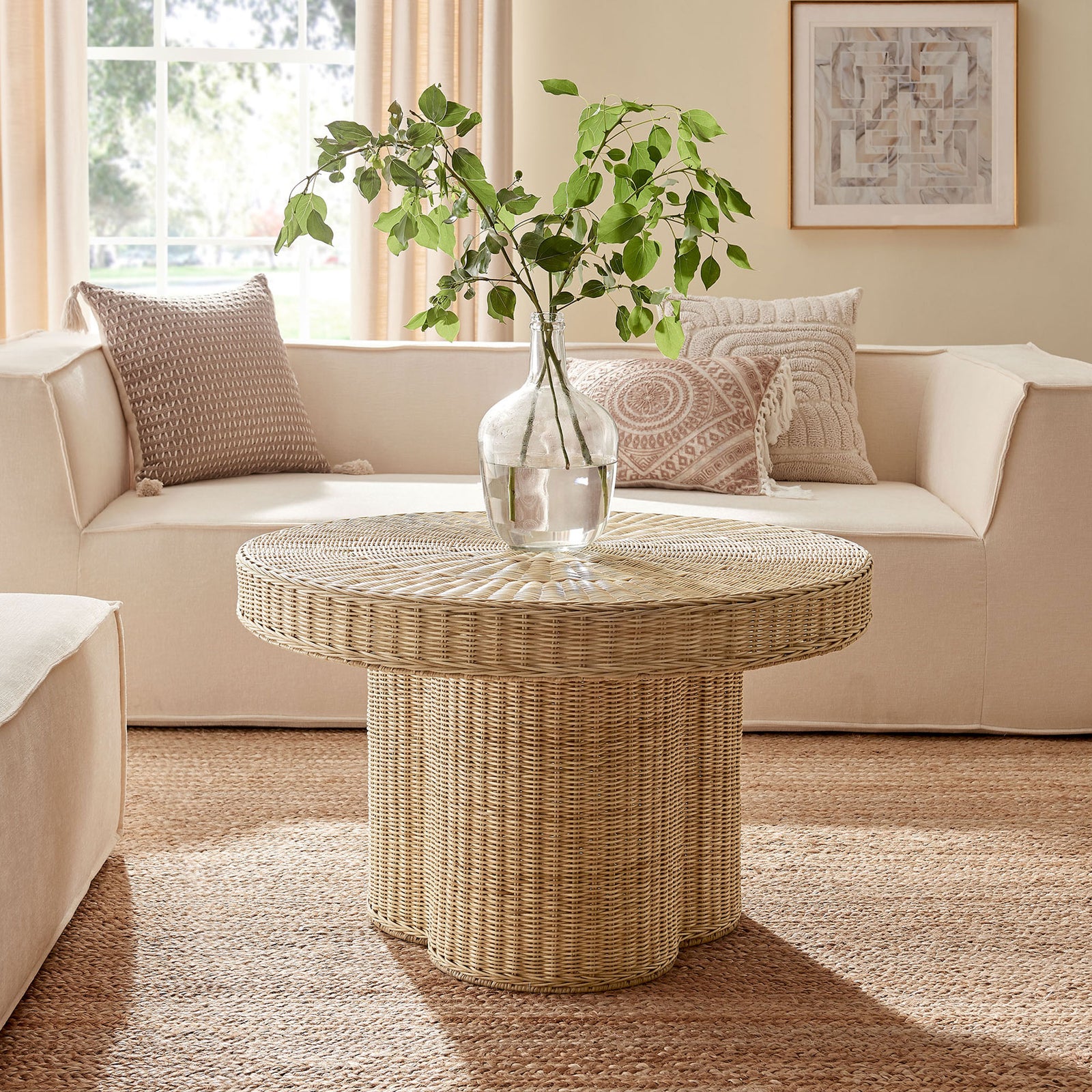 Airy rattan coffee table anchors a cozy living room with relaxed, coastal charm || EEI-7370-NAT || front_angle_room