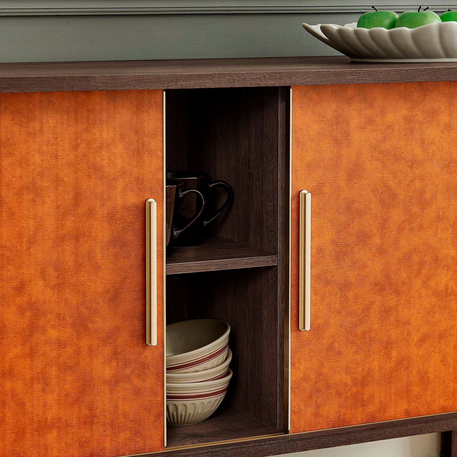 Interior of walnut tan sideboard styled with dishes and mugs, showcasing practical shelving for dining storage || EEI-7373-WAL-TAN || storage_open_room
