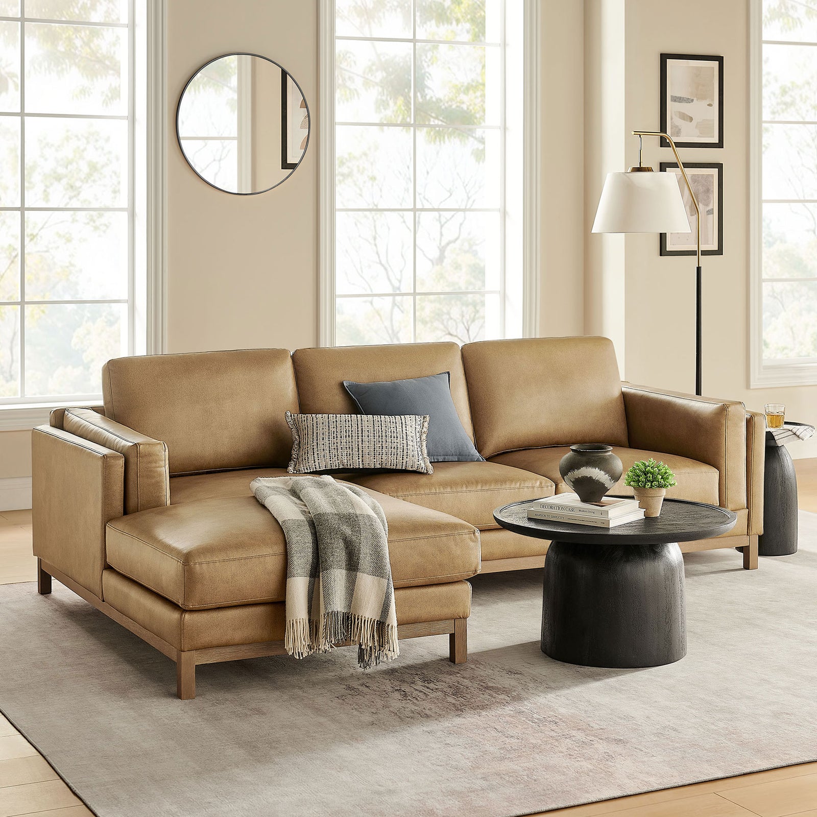 Roscoe sectional styled in bright living room with round coffee table and floor lamp || EEI-7376-TST || front_angle_room
