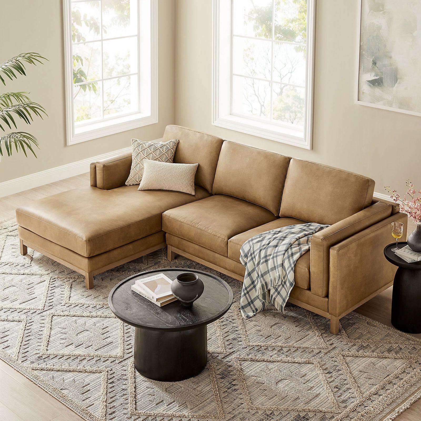 Roscoe sectional with left chaise layered with neutral pillows, throw blanket, and rug || EEI-7376-TST || front_angle_room