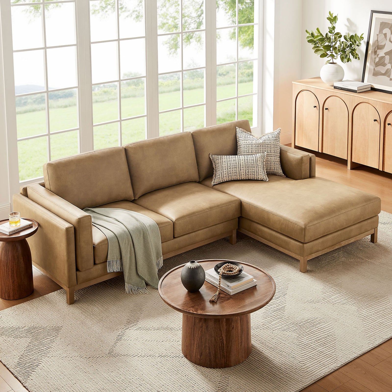 Right-facing Roscoe sectional with chaise layered with pillows and a soft throw || EEI-7377-TST || front_angle_room