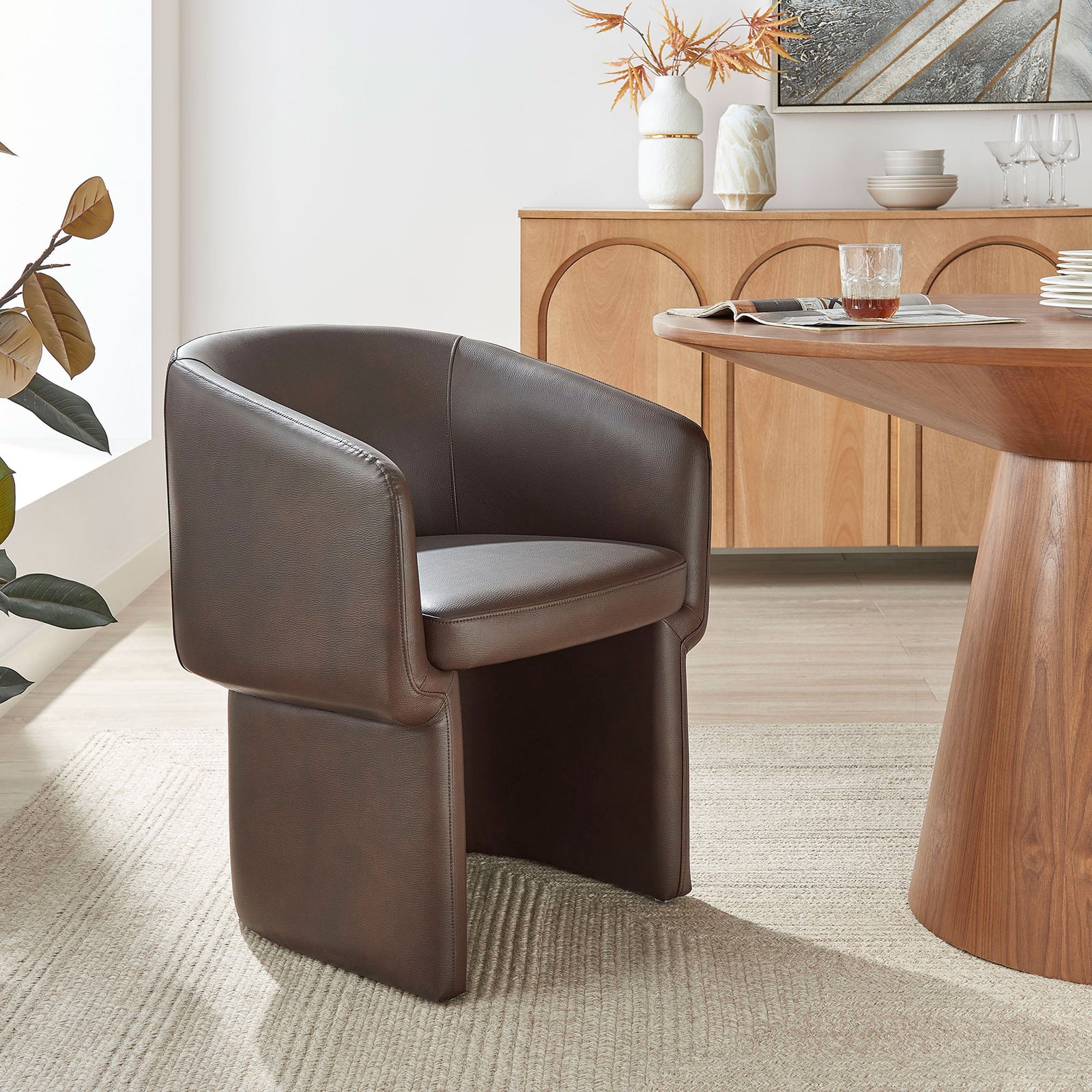 Espresso barrel back dining chair styled at a modern wood table on a neutral woven area rug || EEI-7383-ESP || front_angle_room
