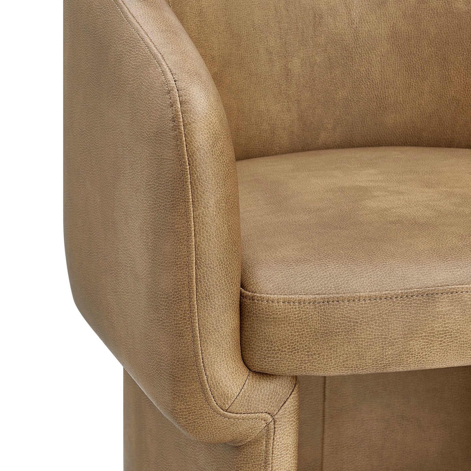 Pebbled vegan leather upholstery and curved arm detail on the toast barrel dining chair. || EEI-7383-TST || detail_studio