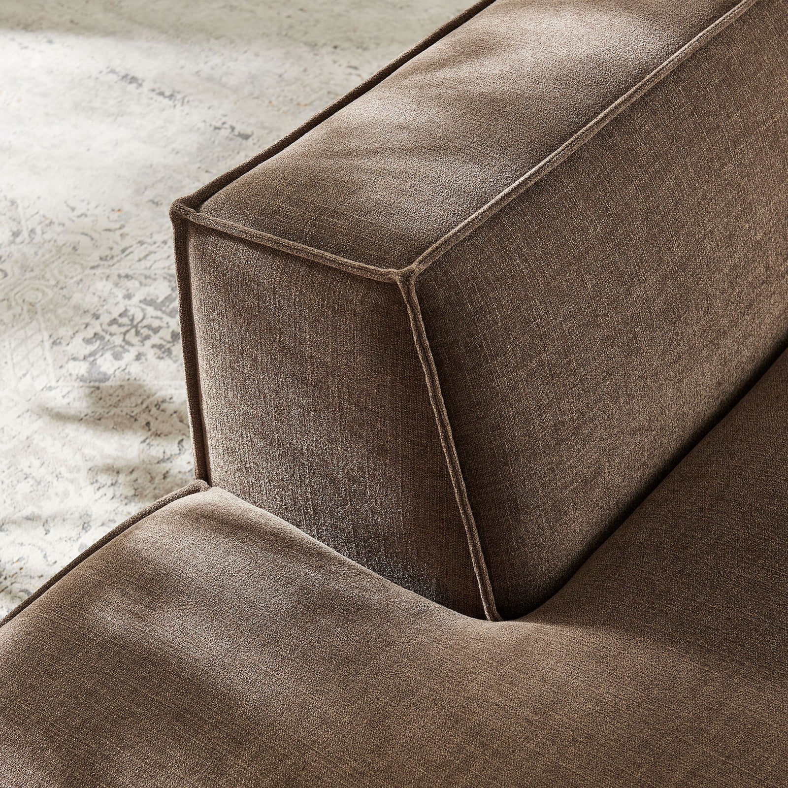 Textured mocha fabric catches the light, highlighting the crisp piping detail || EEI-7386-MOC || detail_room