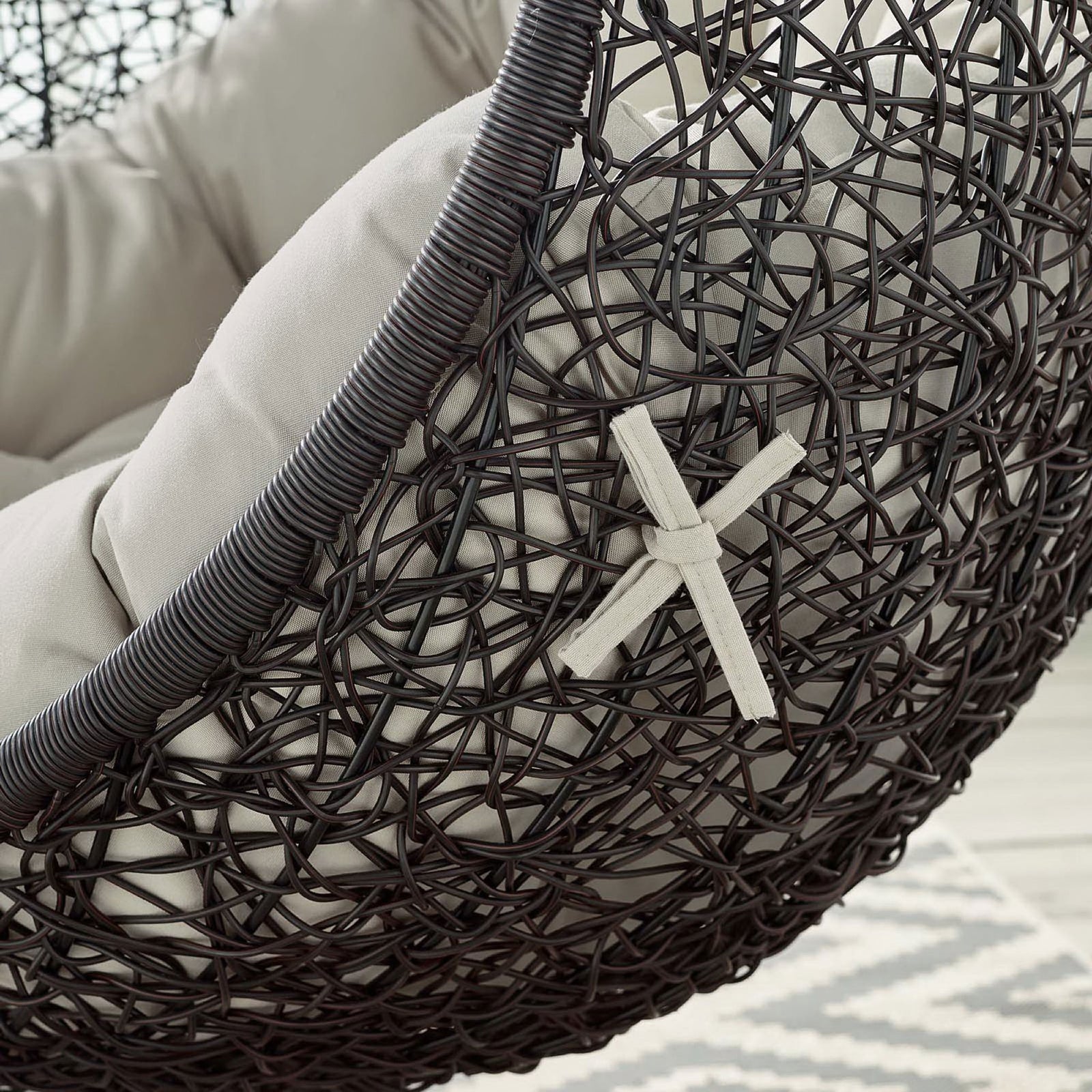 Beige cushion and rattan frame with decorative strap detail add character to the swing chair || EEI-739-BEI-SET || detail_studio