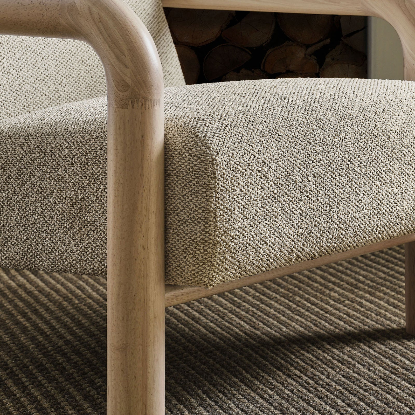 Natural wood arm and nubby boucle seat bring inviting warmth to contemporary interiors || EEI-7391-MRB-OAK || detail_room