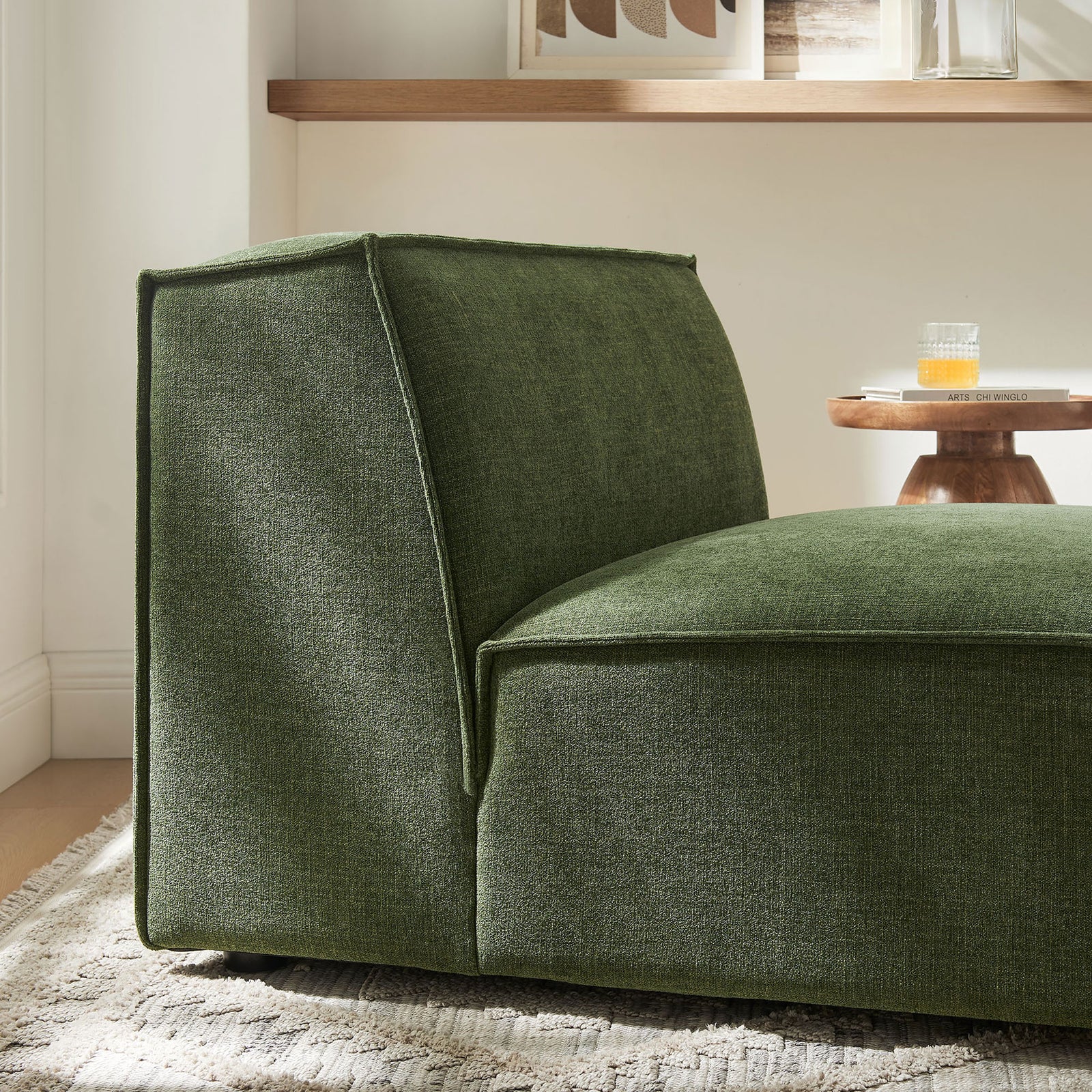 Textured green upholstery and tailored piping bring modern polish to this plush modular chair || EEI-7395-FOL || detail_room
