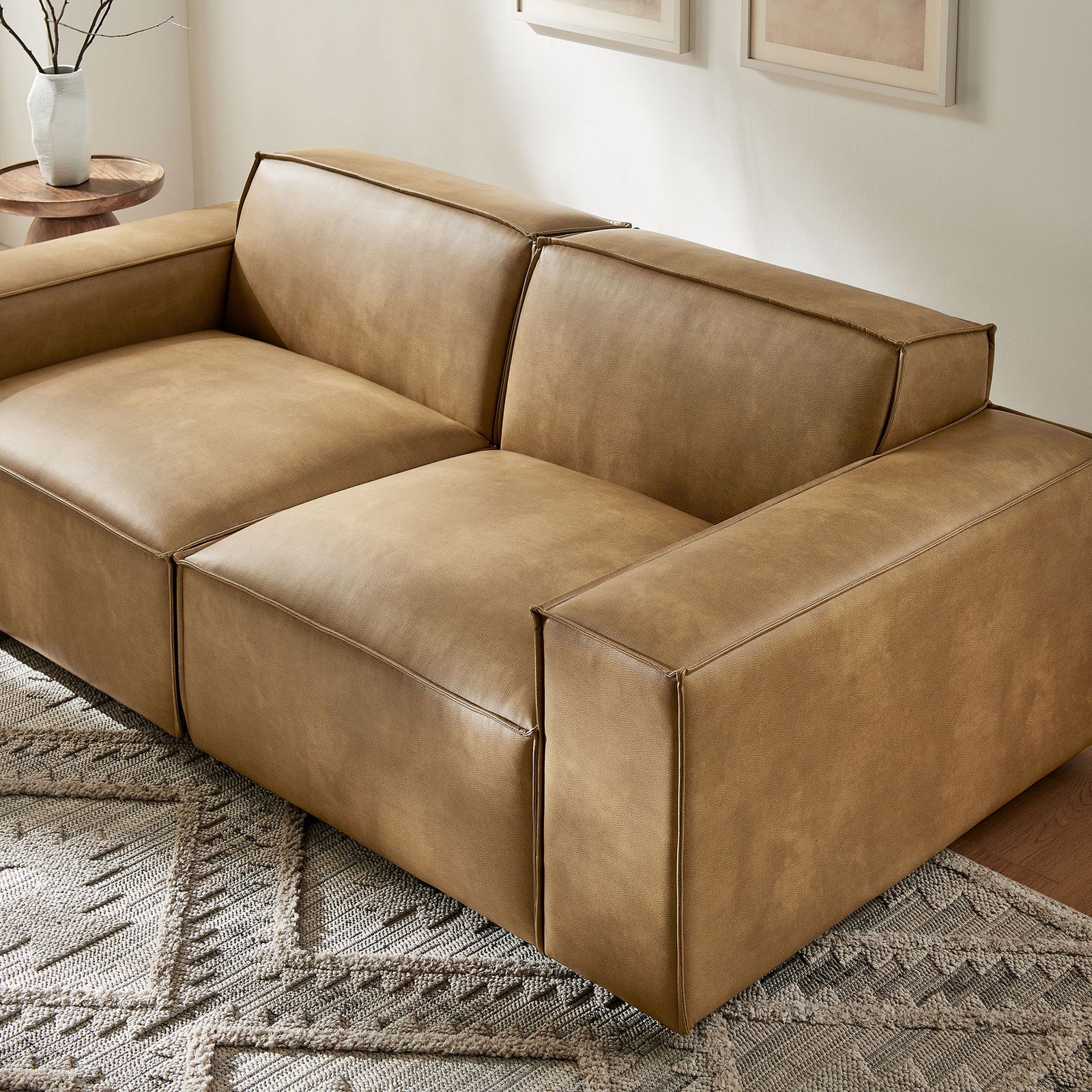Toast modular loveseat anchors the living room with plush seating, wide arms, and warm contemporary style. || EEI-7404-TST || detail_room