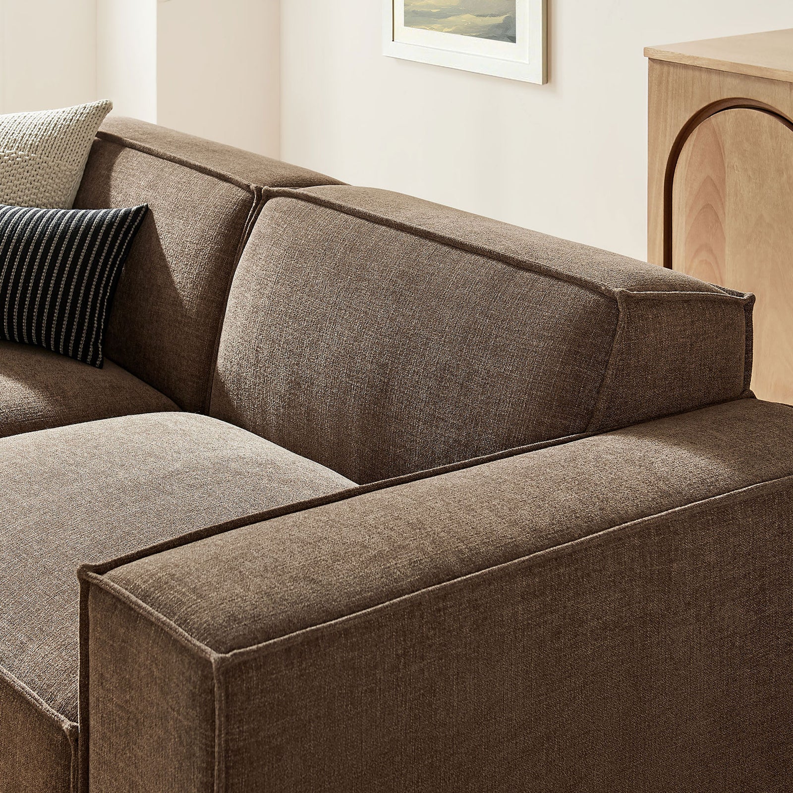 Close-up of mocha upholstery and French piping showcases the loveseat's tailored cushions and plush support. || EEI-7405-MOC || detail_room