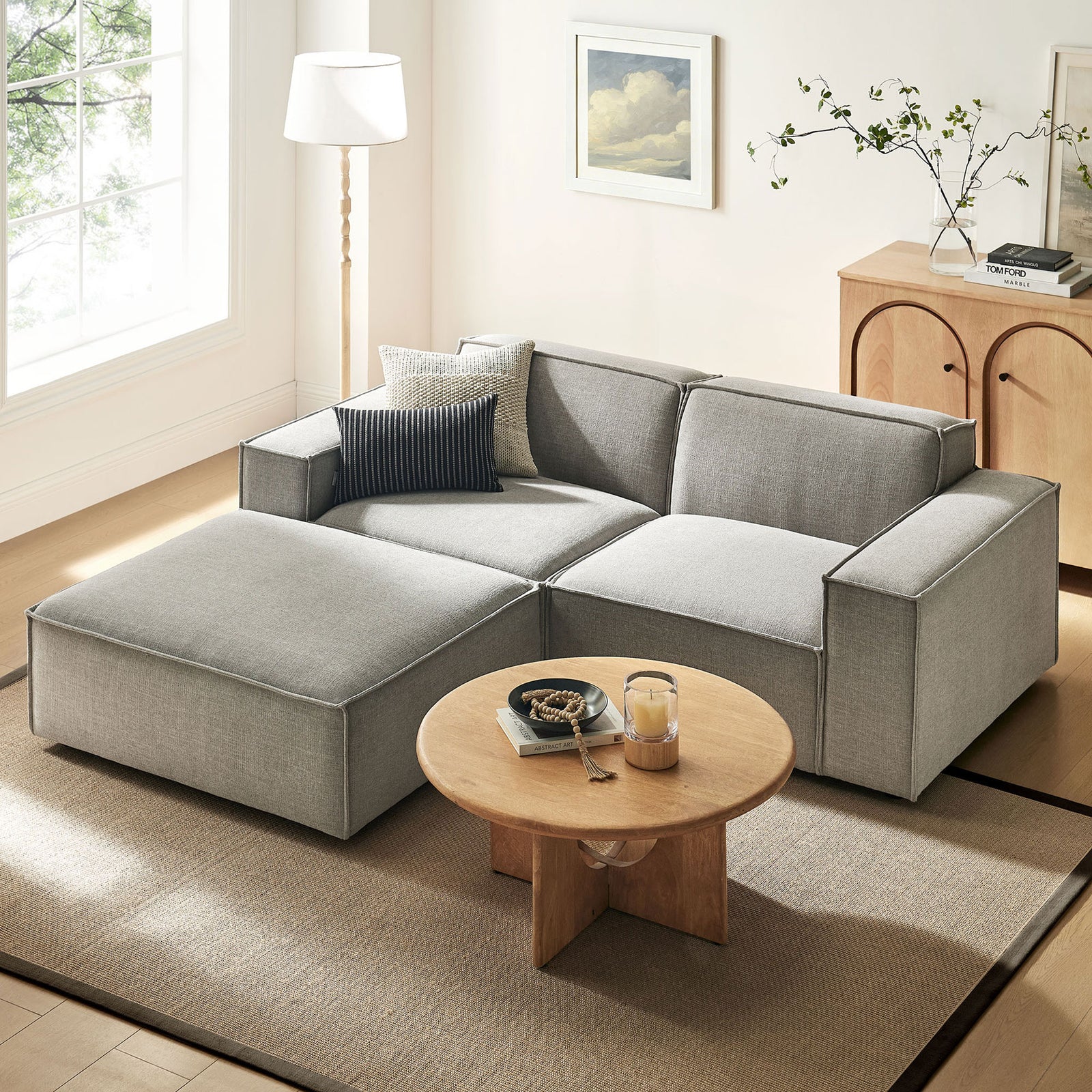 Restore modular loveseat with ottoman in pewter fabric arranged in a bright living room with wood accents || EEI-7405-PEW || front_angle_room