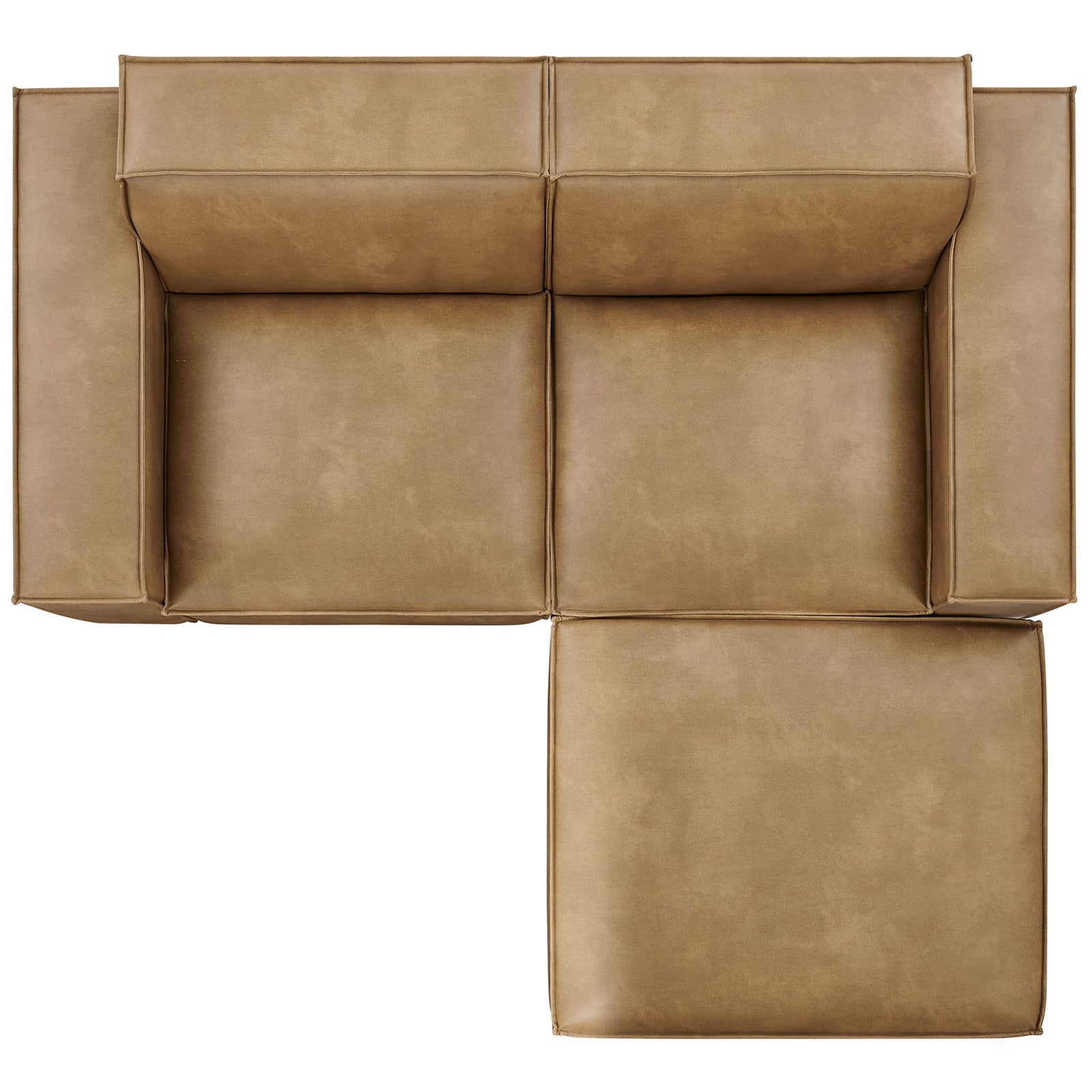 Modular loveseat and ottoman in toast vegan leather arranged in an L-shape to highlight the roomy chaise layout || EEI-7406-TST || top_studio
