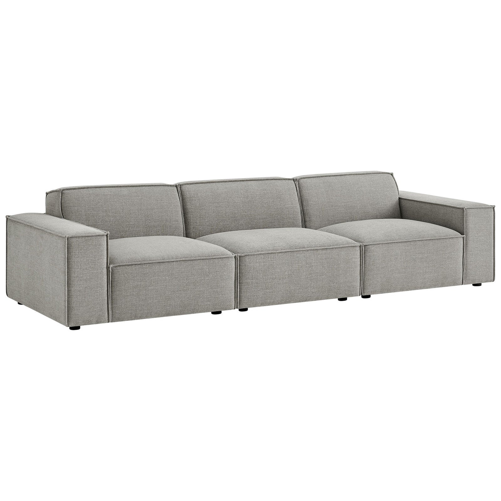Low profile modular sofa in pewter fabric featuring French piping and deep, lounge ready seats. || EEI-7407-PEW || front_angle_studio