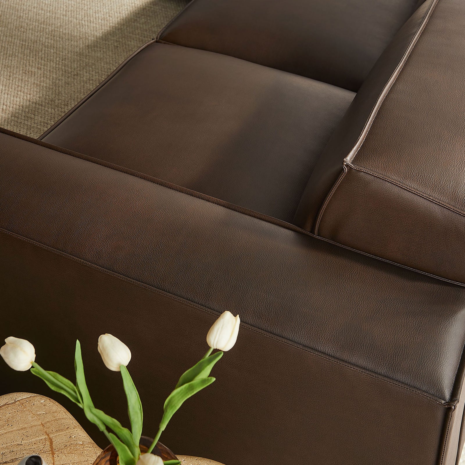 Wide espresso armrest and seat highlight the supple vegan leather texture and crisp, contemporary tailoring || EEI-7412-ESP || detail_room