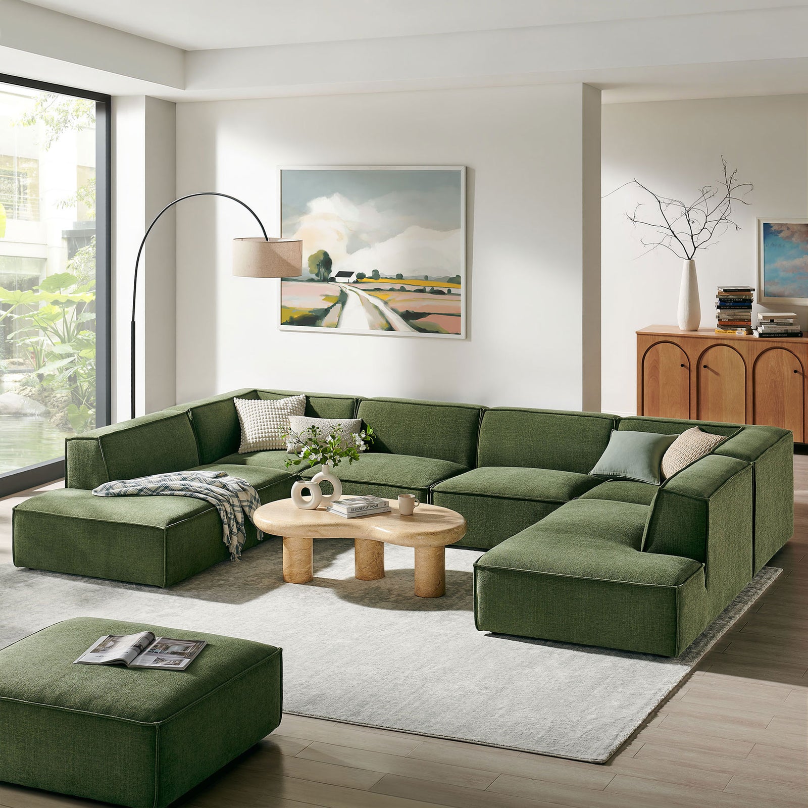 Modern U-shaped Restore sectional anchors a bright living room with generous seating in foliage green fabric || EEI-7415-FOL || front_angle_room