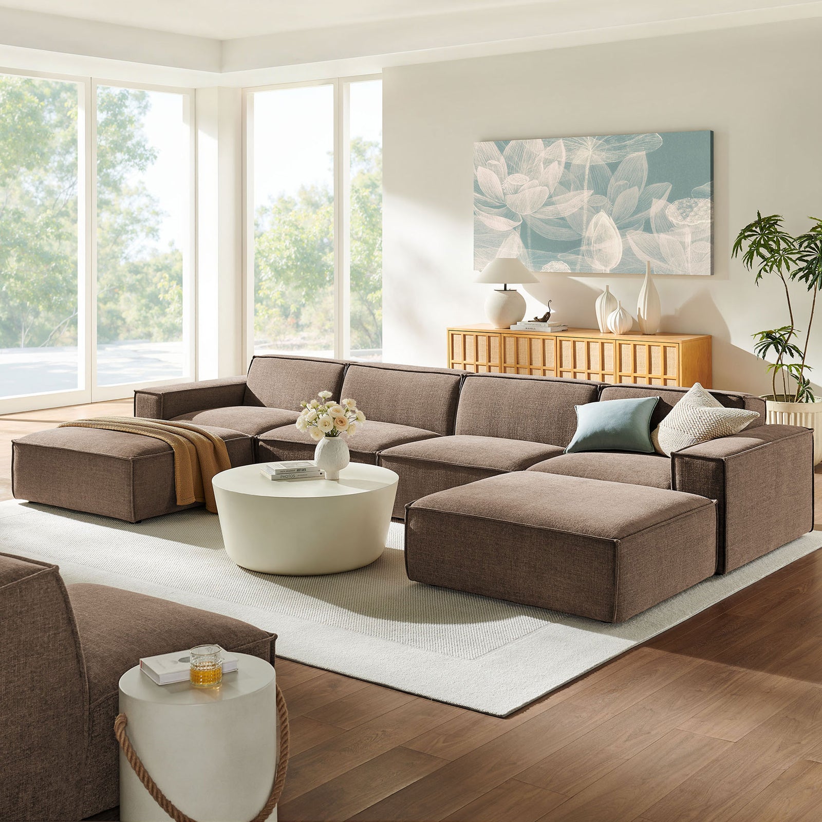 Mocha modular sectional styled in a bright living room with ottomans for relaxed lounging || EEI-7417-MOC || front_angle_room