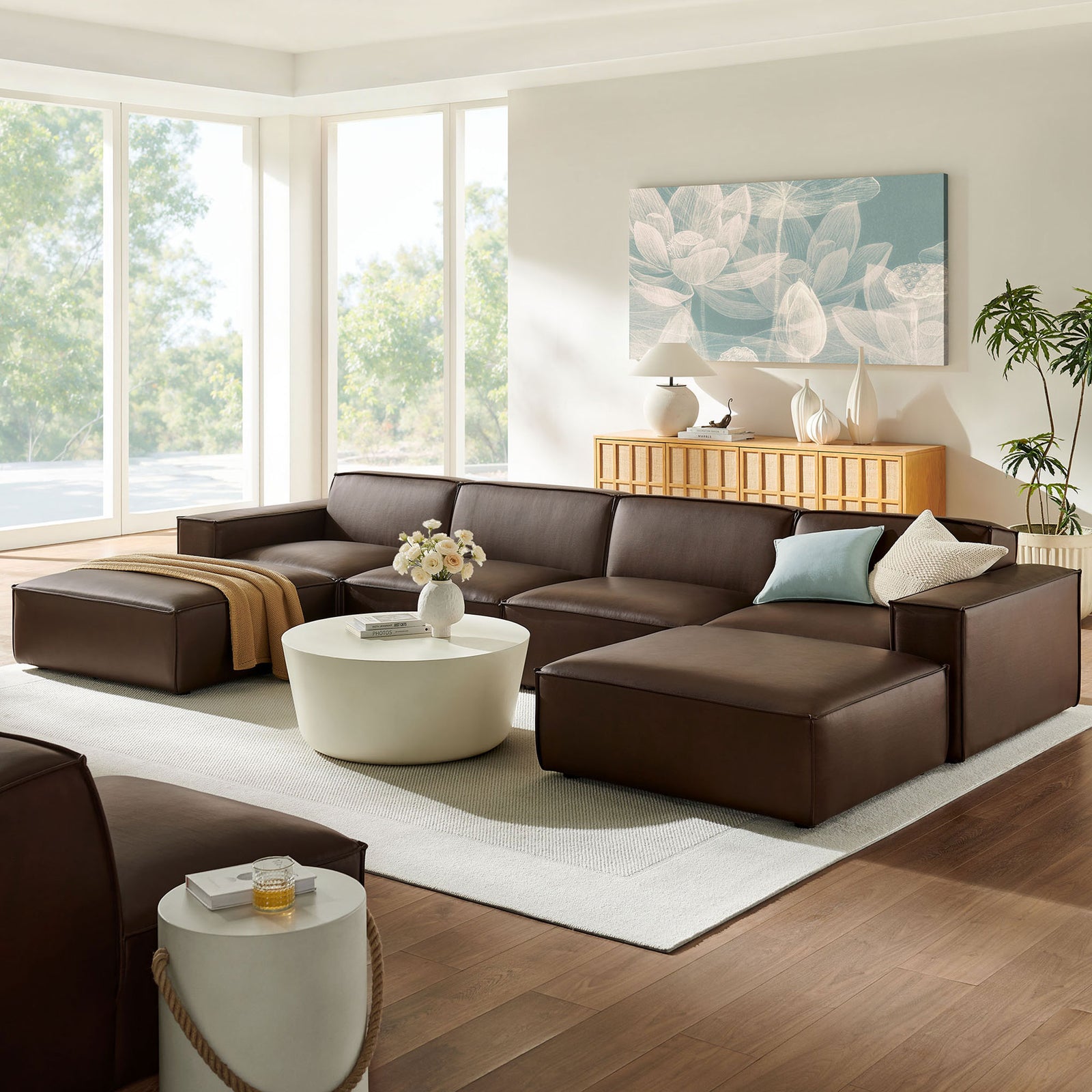 Espresso modular sectional anchors a bright living room with plush cushions, ottomans, and sleek modern lines || EEI-7418-ESP || front_angle_room