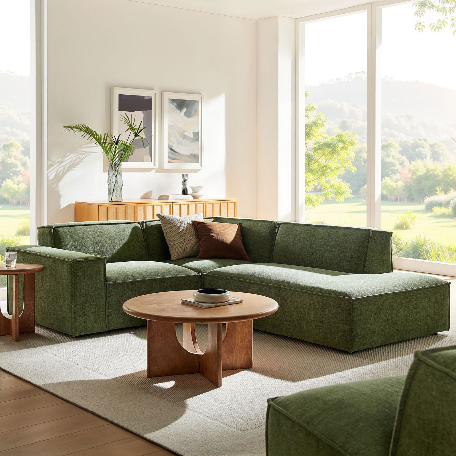 Green modular sectional with chaise styled in a bright living room with wood coffee table and neutral rug || EEI-7421-FOL || front_angle_room