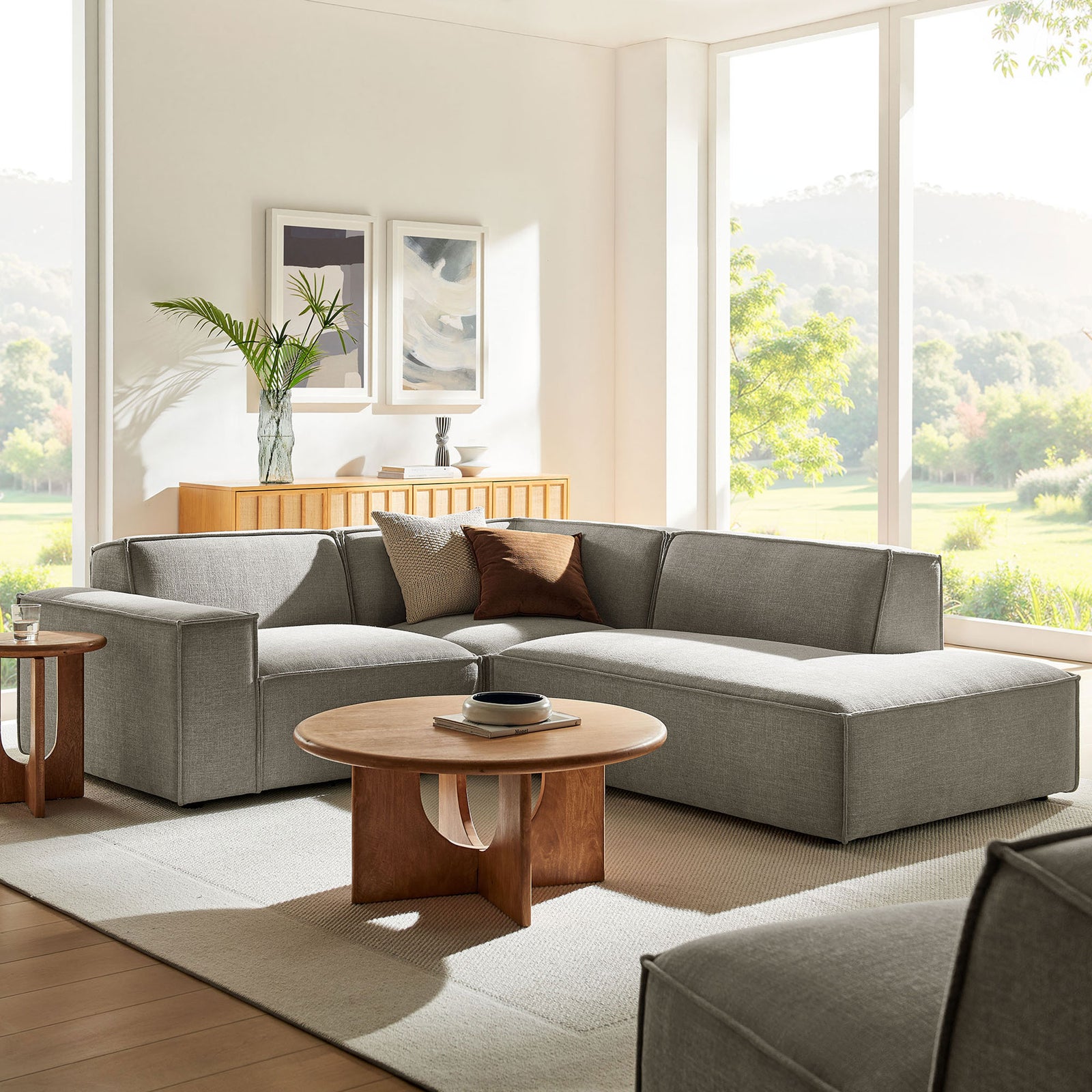 Right-facing pewter sectional styled in a bright living room with neutral rug and warm wood accents. || EEI-7421-PEW || front_angle_room