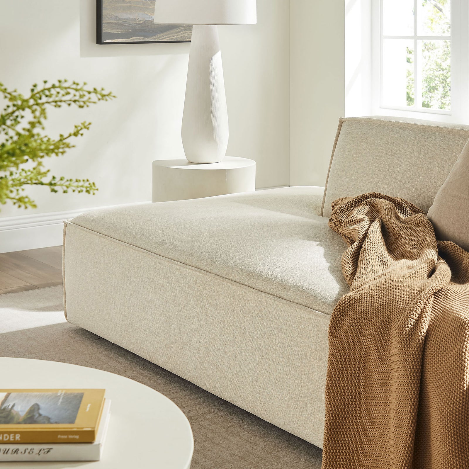 Deep cushioned chaise seat in ecru performance fabric creating a cozy spot for relaxed everyday lounging || EEI-7423-ECR || detail_room