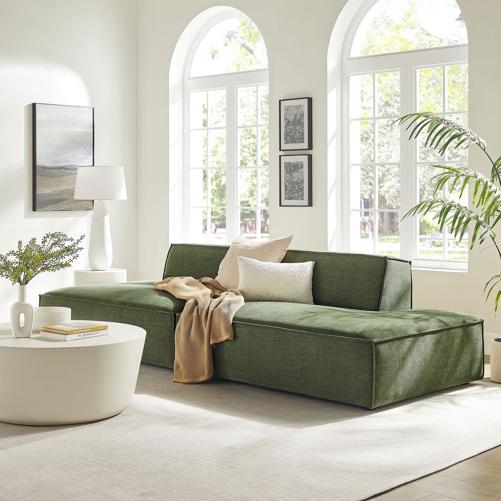 Foliage green modular loveseat styled in a bright living room for modern, minimalist comfort. || EEI-7423-FOL || front_angle_room