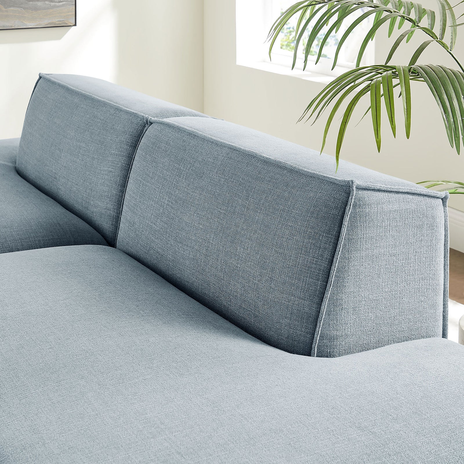 Supportive sky blue back cushions with crisp French piping for a modern tailored look || EEI-7423-SKY || detail_room